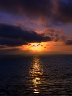 240x320 Beautiful sunset over Brazilian beach wallpaper