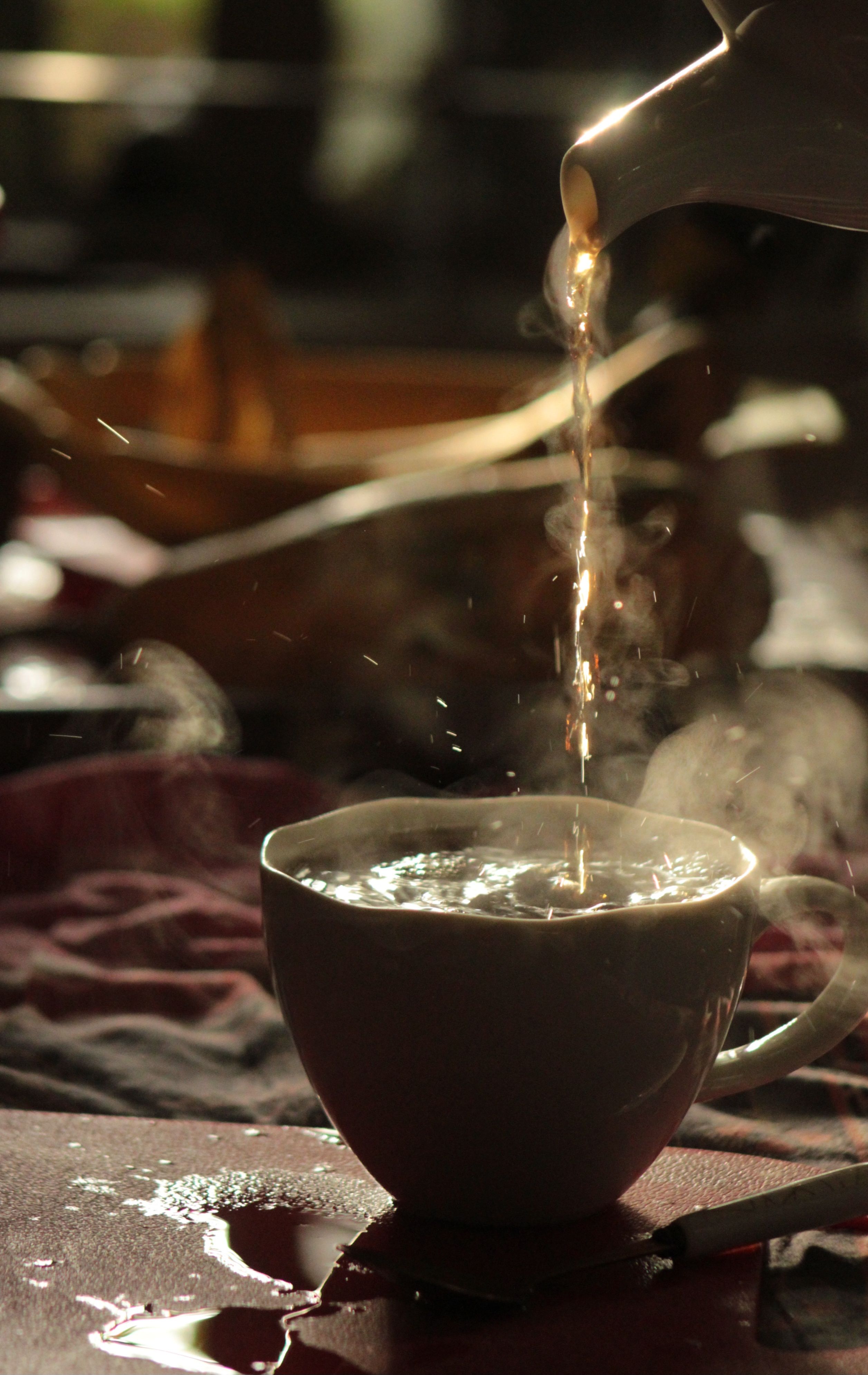 2513x3979 Steaming Hot Tea Poured into Cup in Cozy Setting · Free