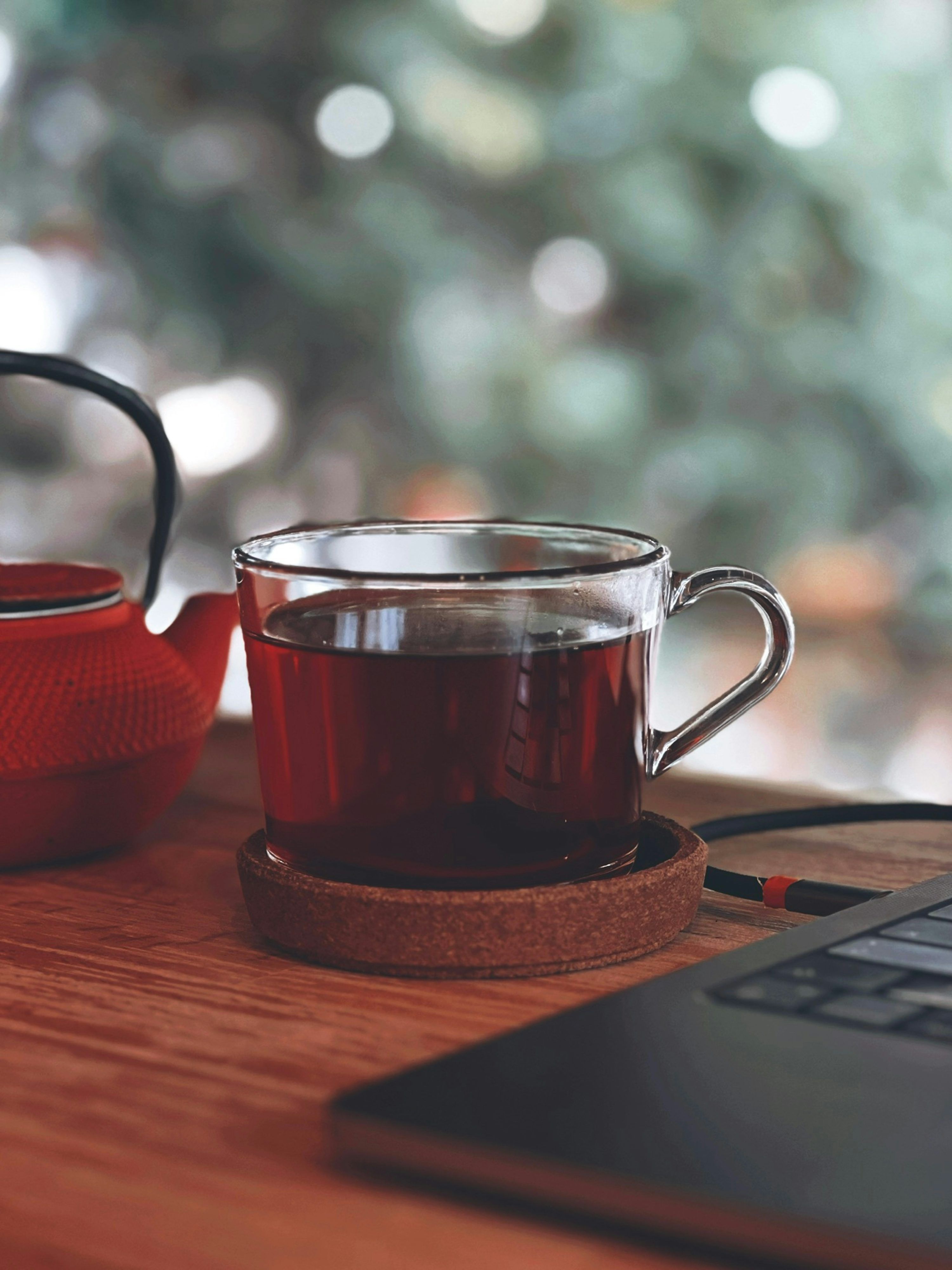 3000x4000 A cup of tea next to a laptop computer