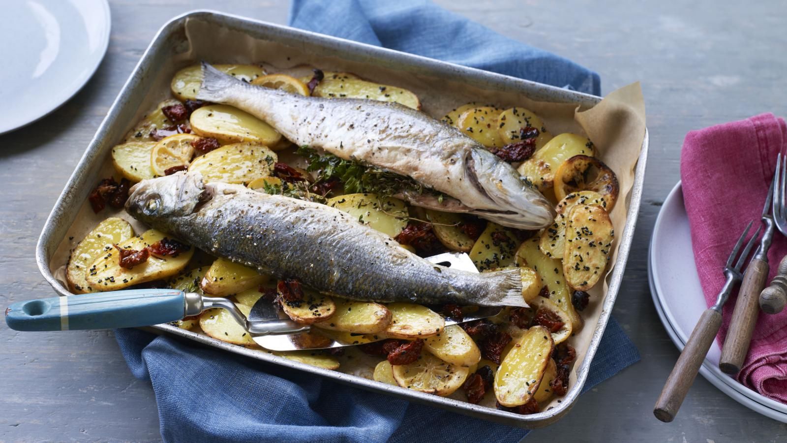 1600x900 Whole baked fish with potatoes, lemon and sundried tomatoes