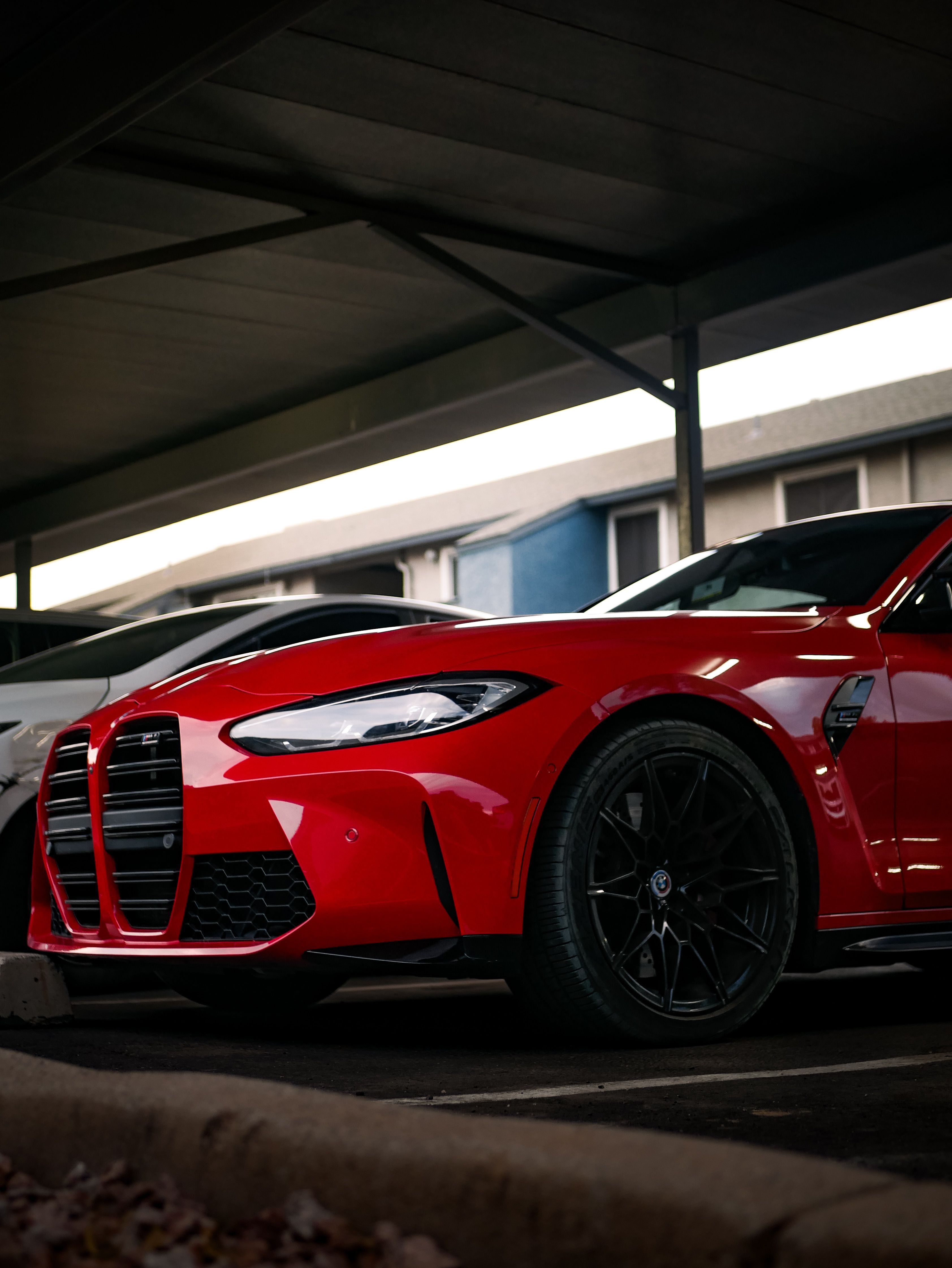3367x4484 Sleek Red BMW M Model in Urban Setting · Free