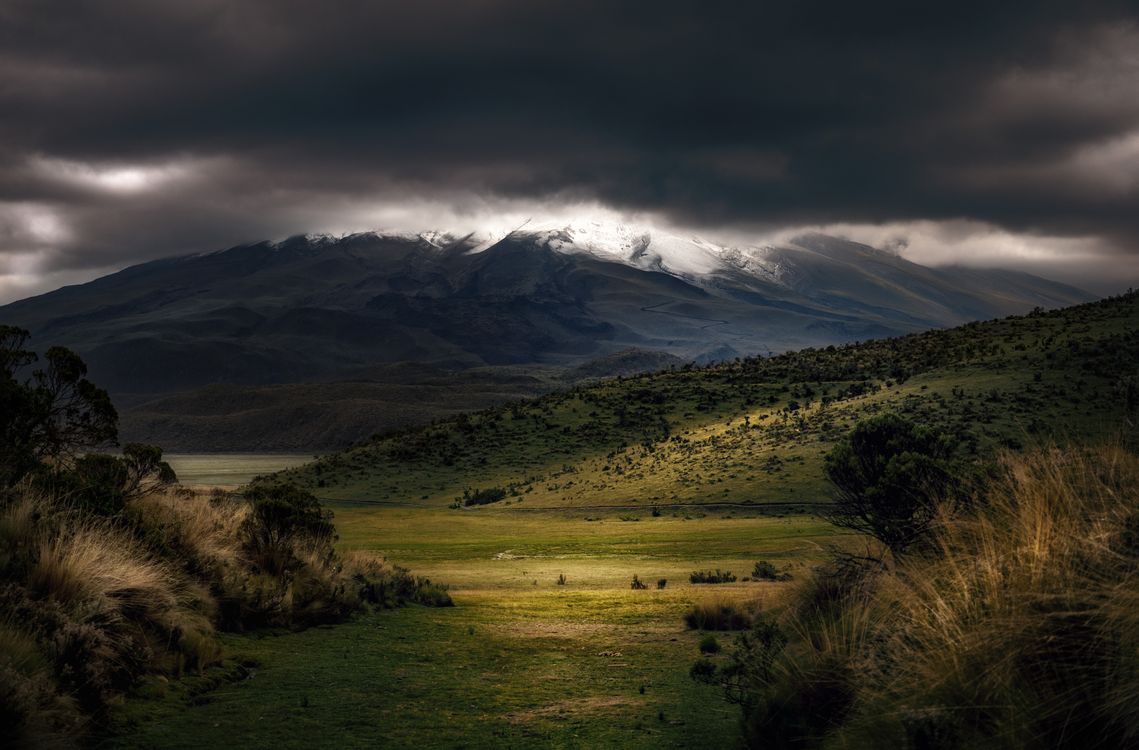 1139x750 Photography of Mountains Under Cloudy Sky · Free