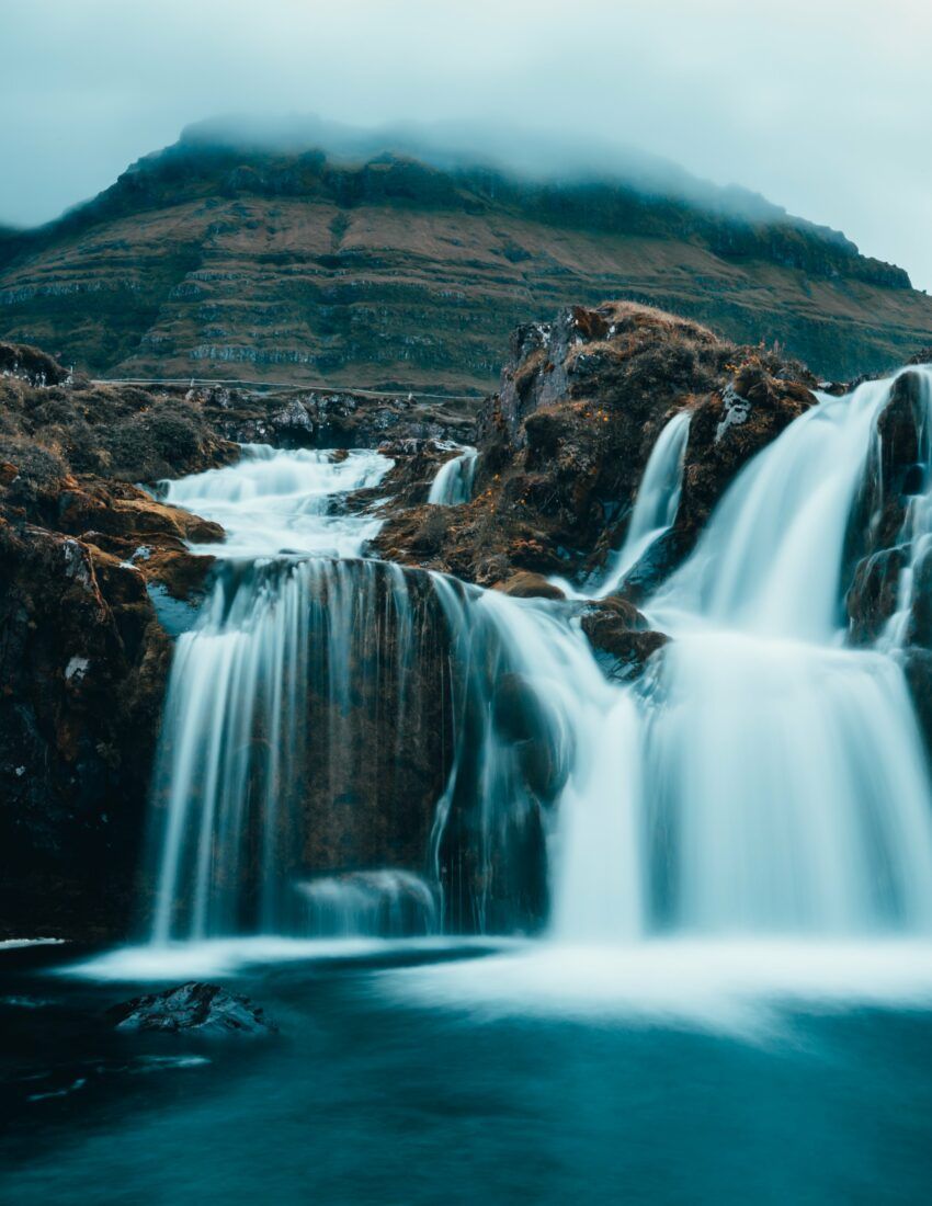 850x1100 Cloudy Mountain Waterfall Royalty Free