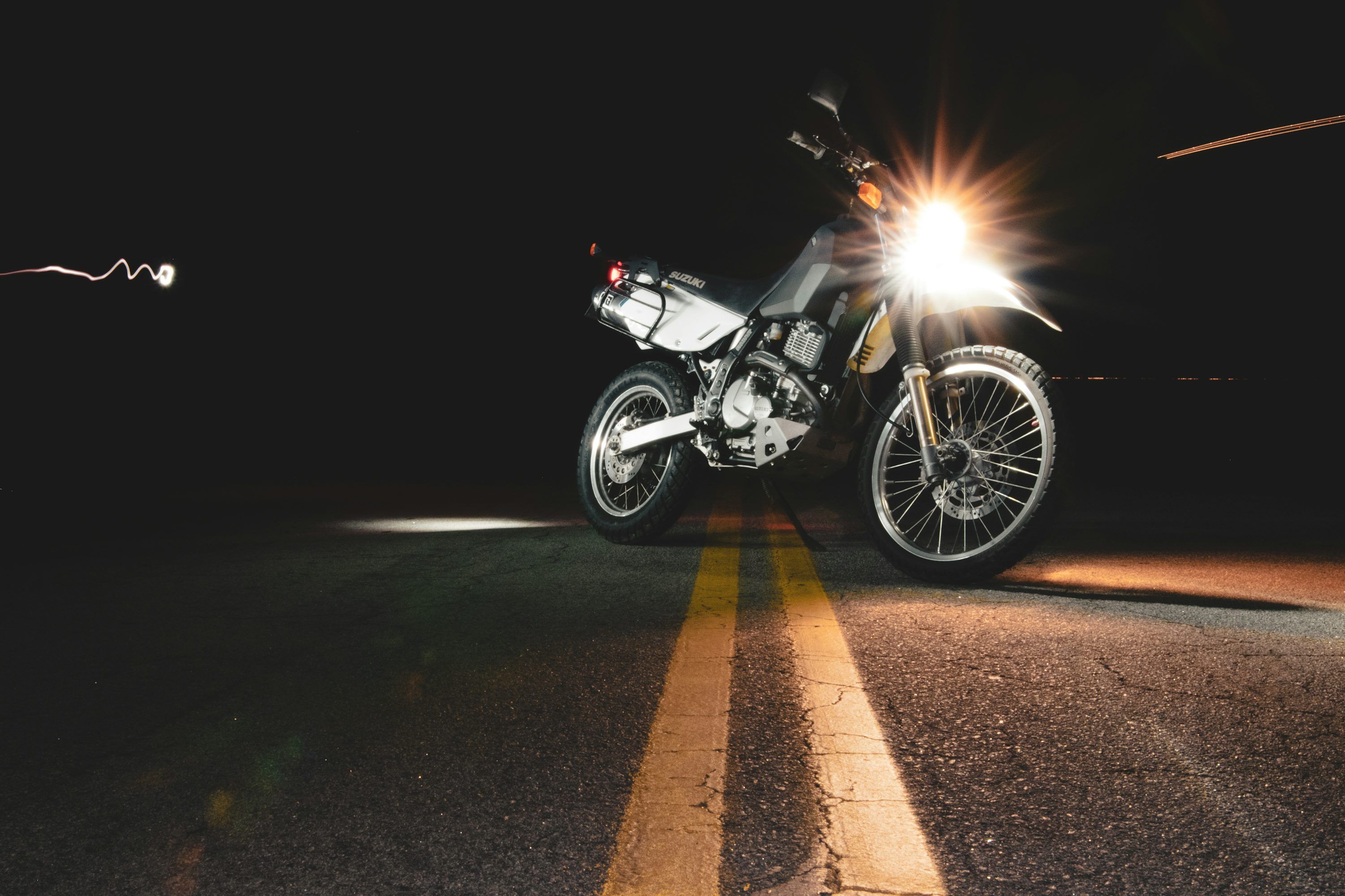 3000x2000 Lighted headlight of parked motorcycle
