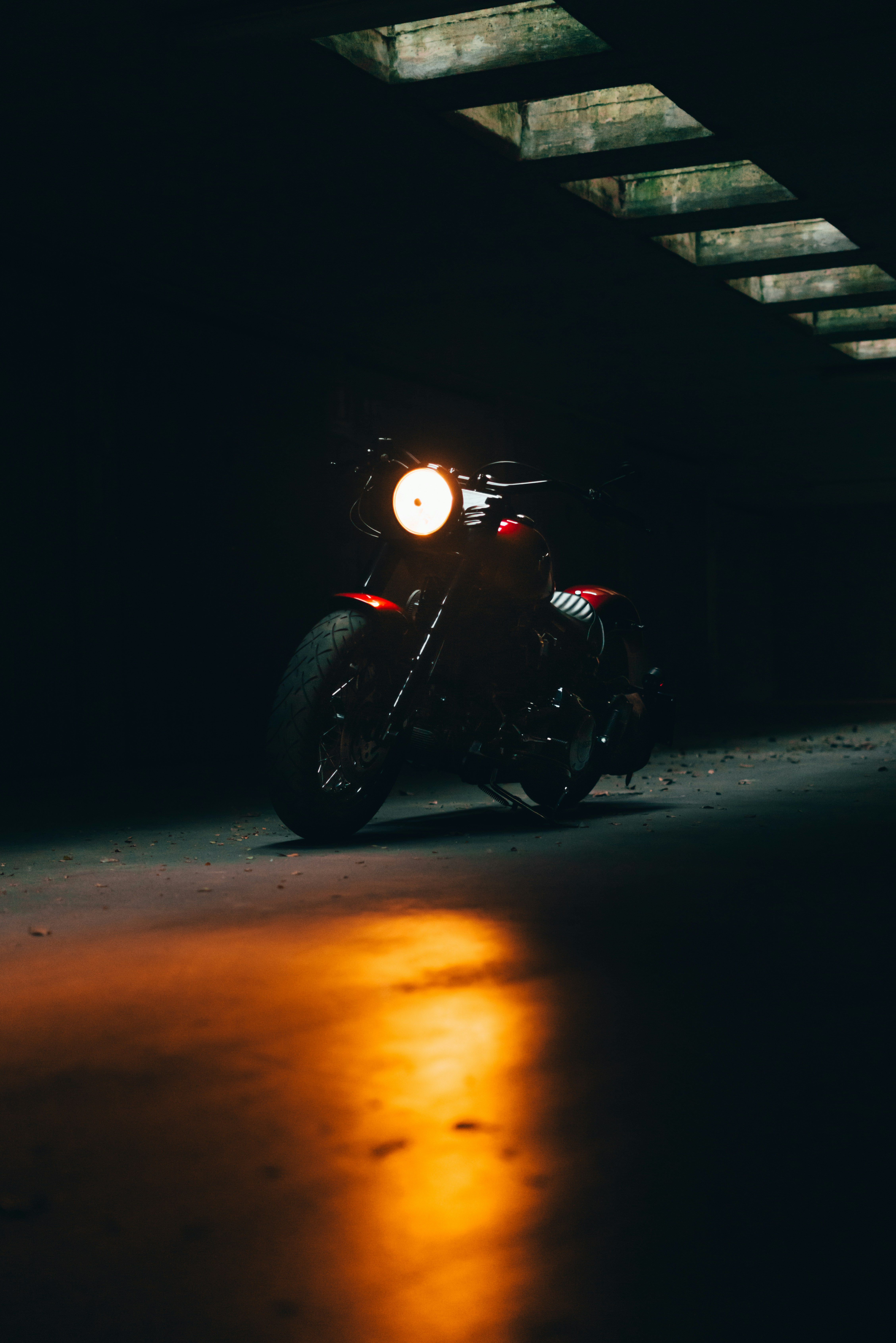4515x6765 A motorcycle with a red light on it's headlight