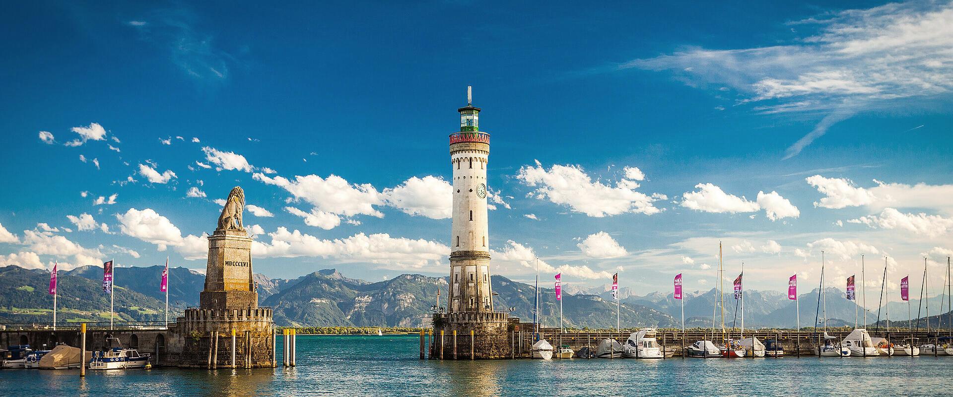 1920x800 The Harbor Gate of Lindau, Germany, situated on Lake Constance. The Lighthouse and Bavarian Lion were erected in 1856