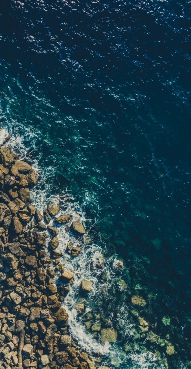 736x1420 Aerial View of Ocean and Rocks. Rough seas wallpaper, Deep sea aesthetic wallpaper, Ocean texture