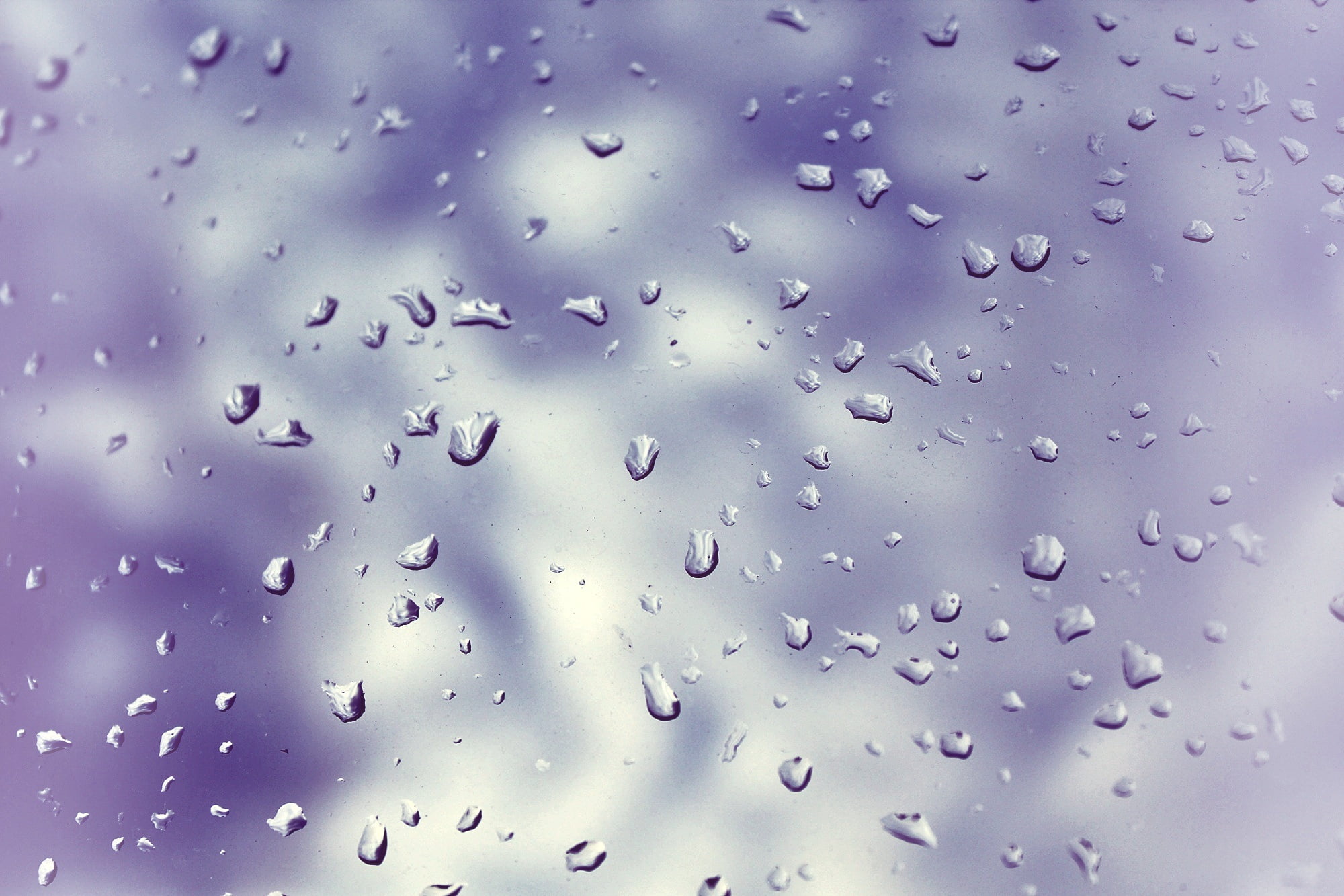 2000x1333 Water drops on glass panel HD wallpaper
