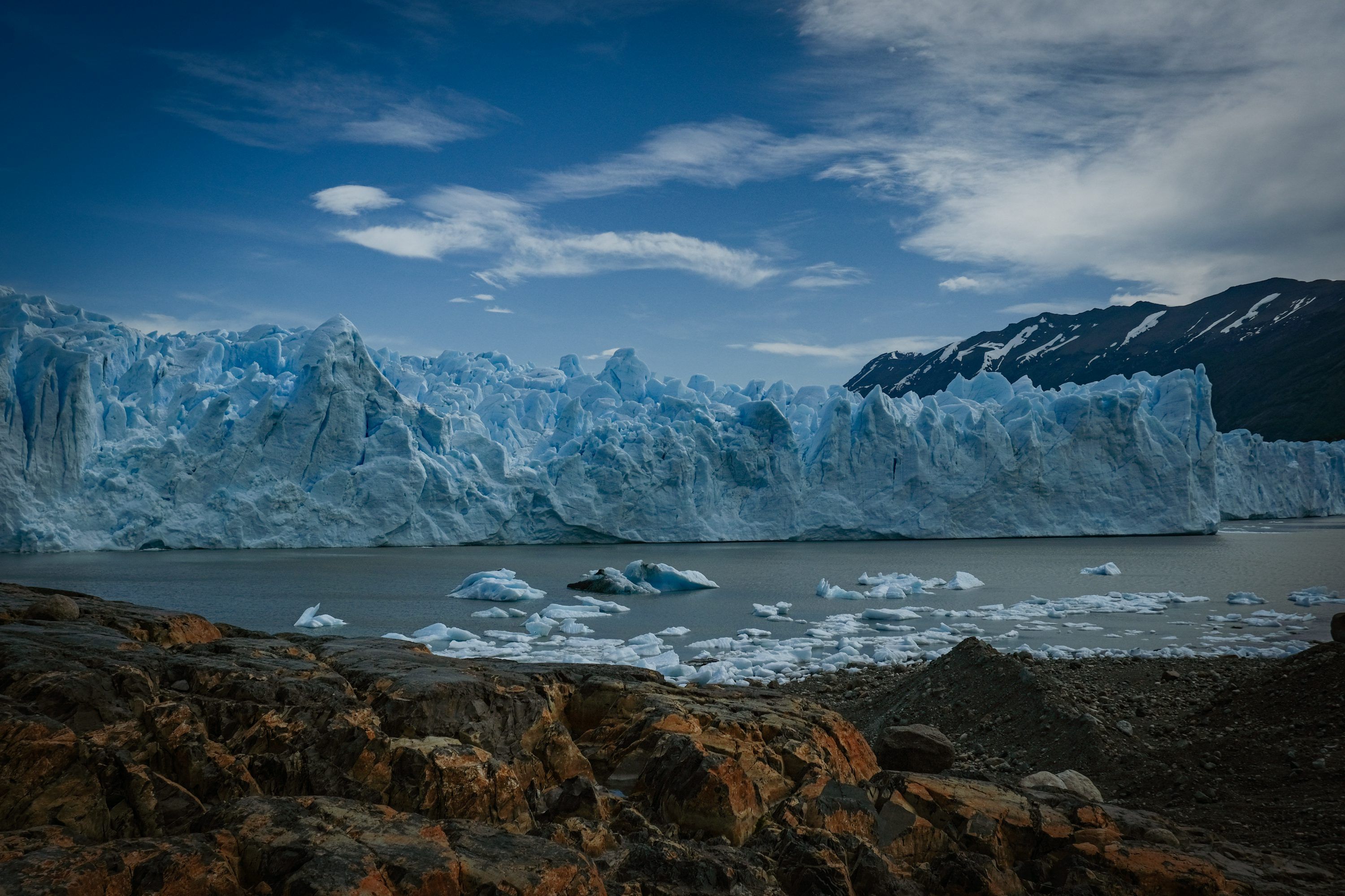 3000x2000 A body of water with ice and snow on the side with Perito Moreno Glacier in the background