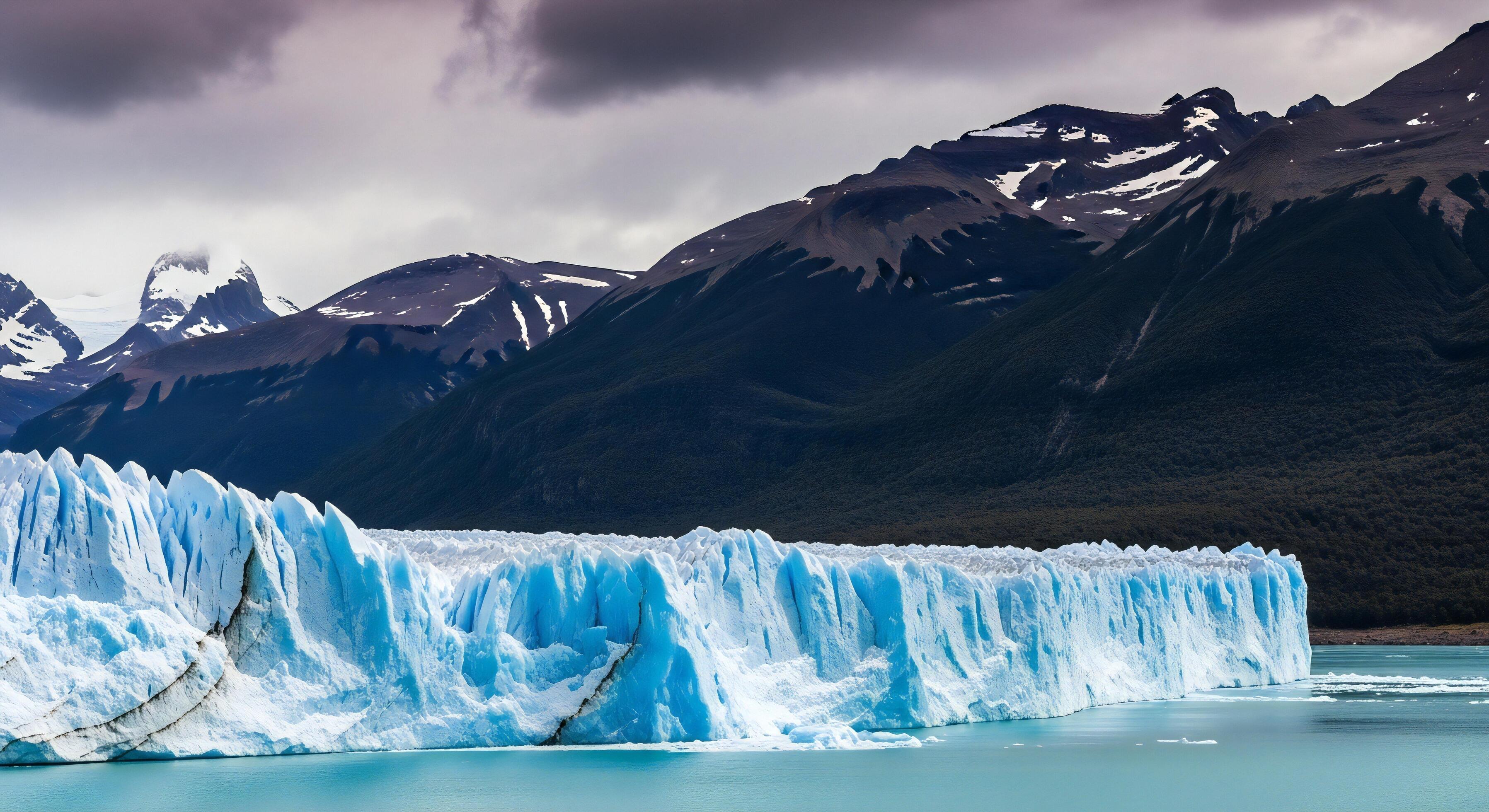 3593x1960 Nature background, Nature wallpaper, Perito Moreno Glacier's towering blue ice face meets turquoise water backed by dark forested mountains and cloudy skies