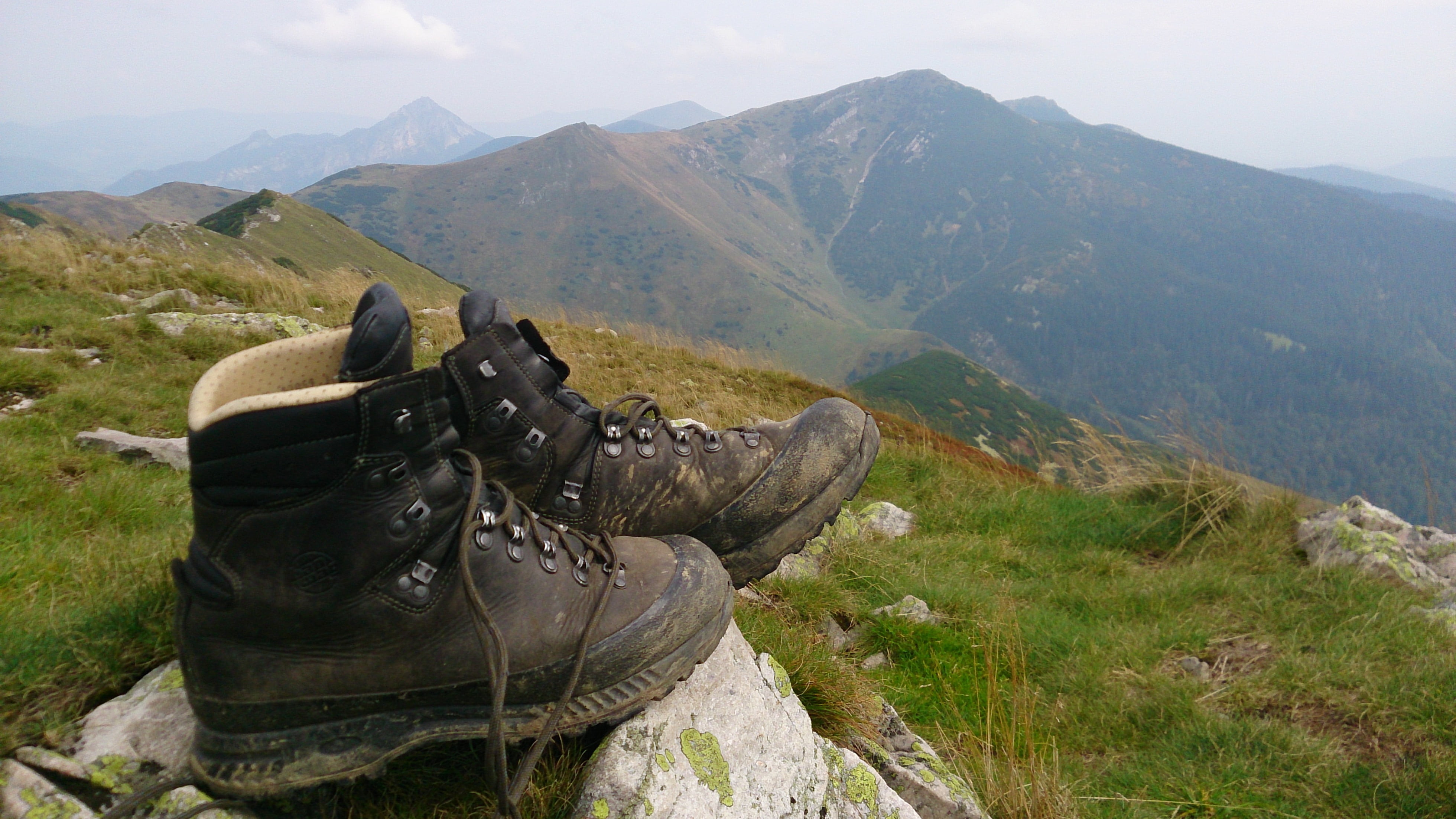 3920x2204 Royalty Free Photo: Pair Of Black Work Boots On Mountain