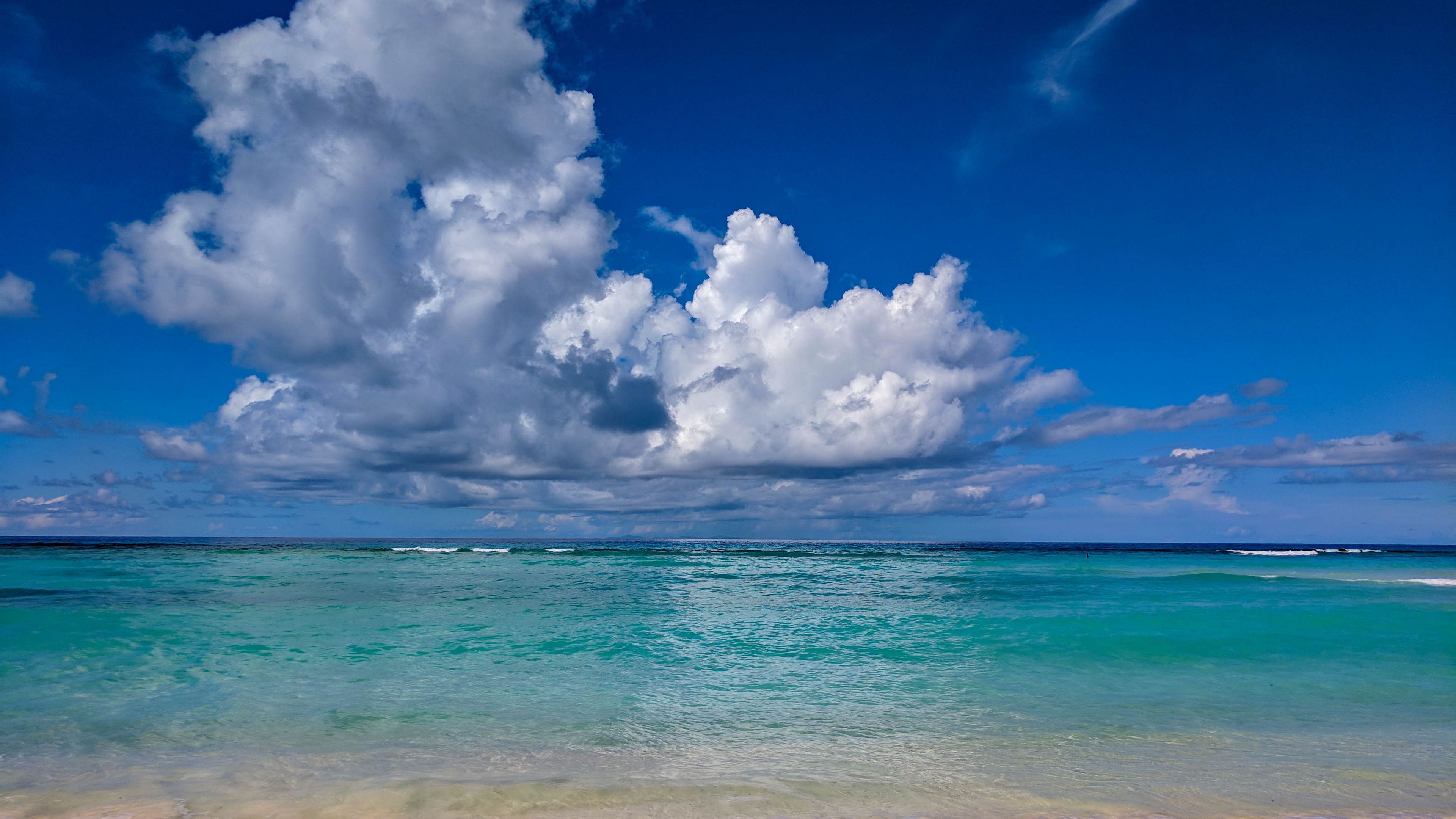 3840x2160 Beach Waves Calm Body Of Water Under White Clouds Blue Sky 4K HD Ocean Wallpaper