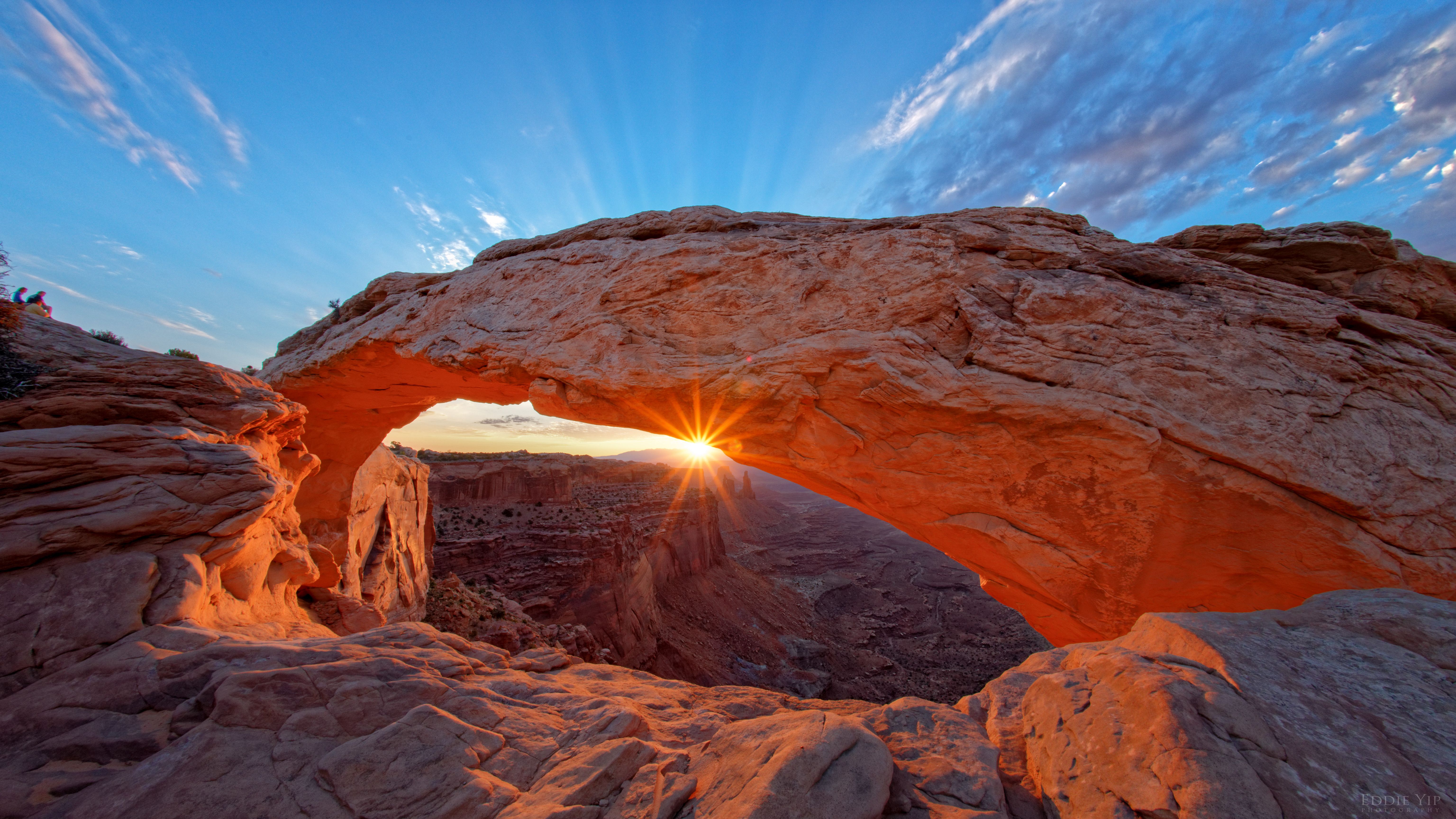 6144x3456 Download wallpaper 6144x3456 arch, rock, stone, rays, sun HD background