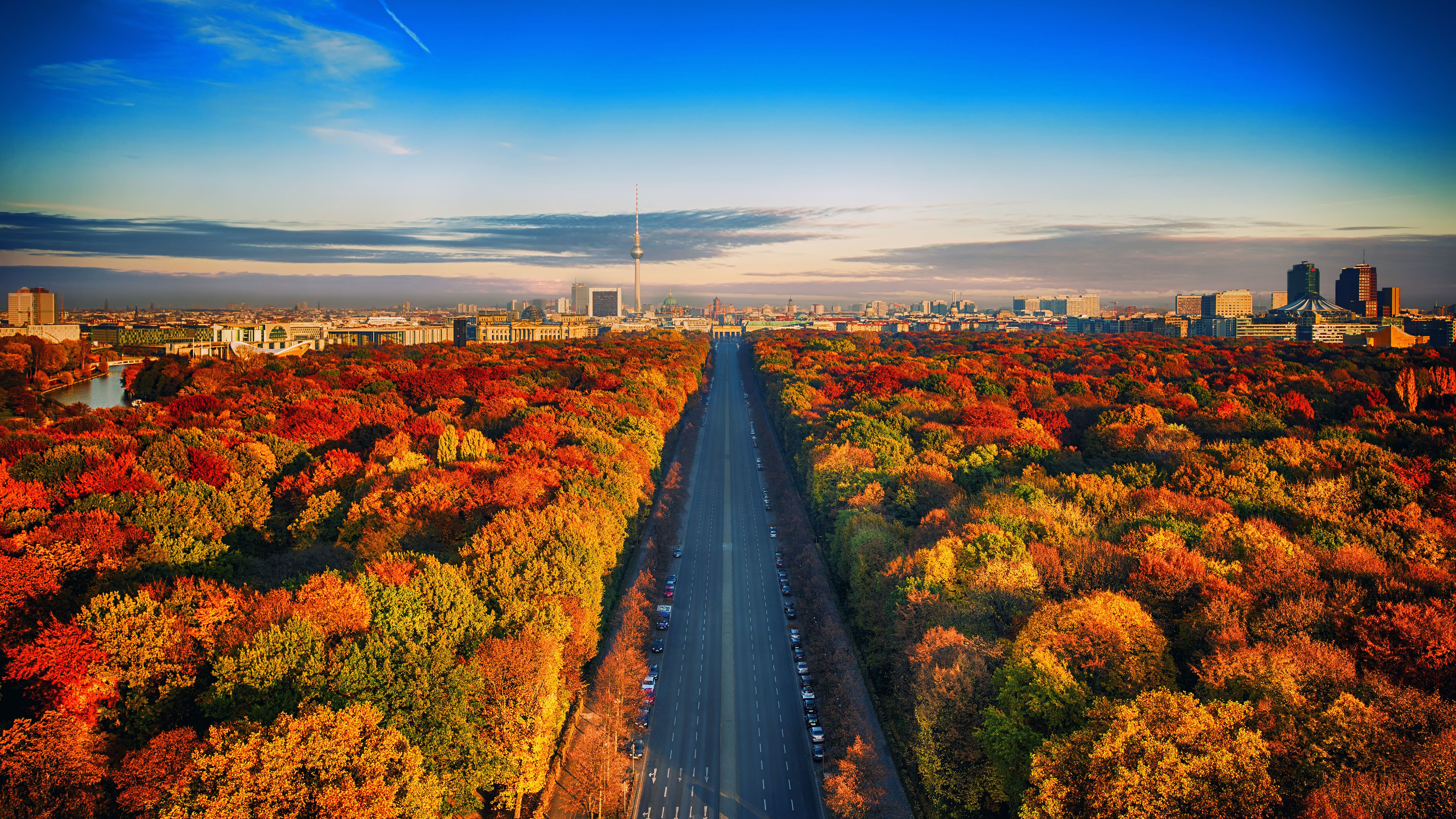 5120x2880 Autumn Serenity: Berlin's Highway Through Vibrant Forest Ultra HD Wallpaperx2880