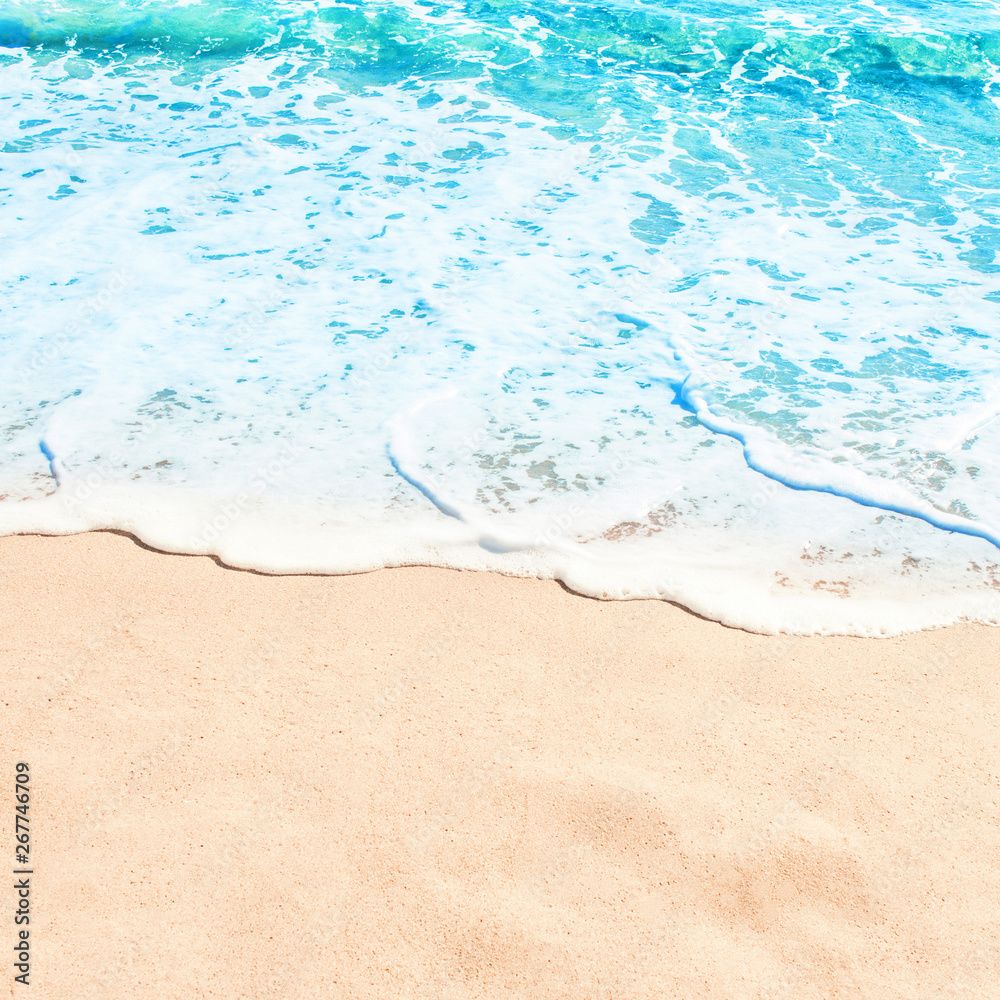 1000x1000 Blue ocean wave on sandy beach. Summer day and sand beach background