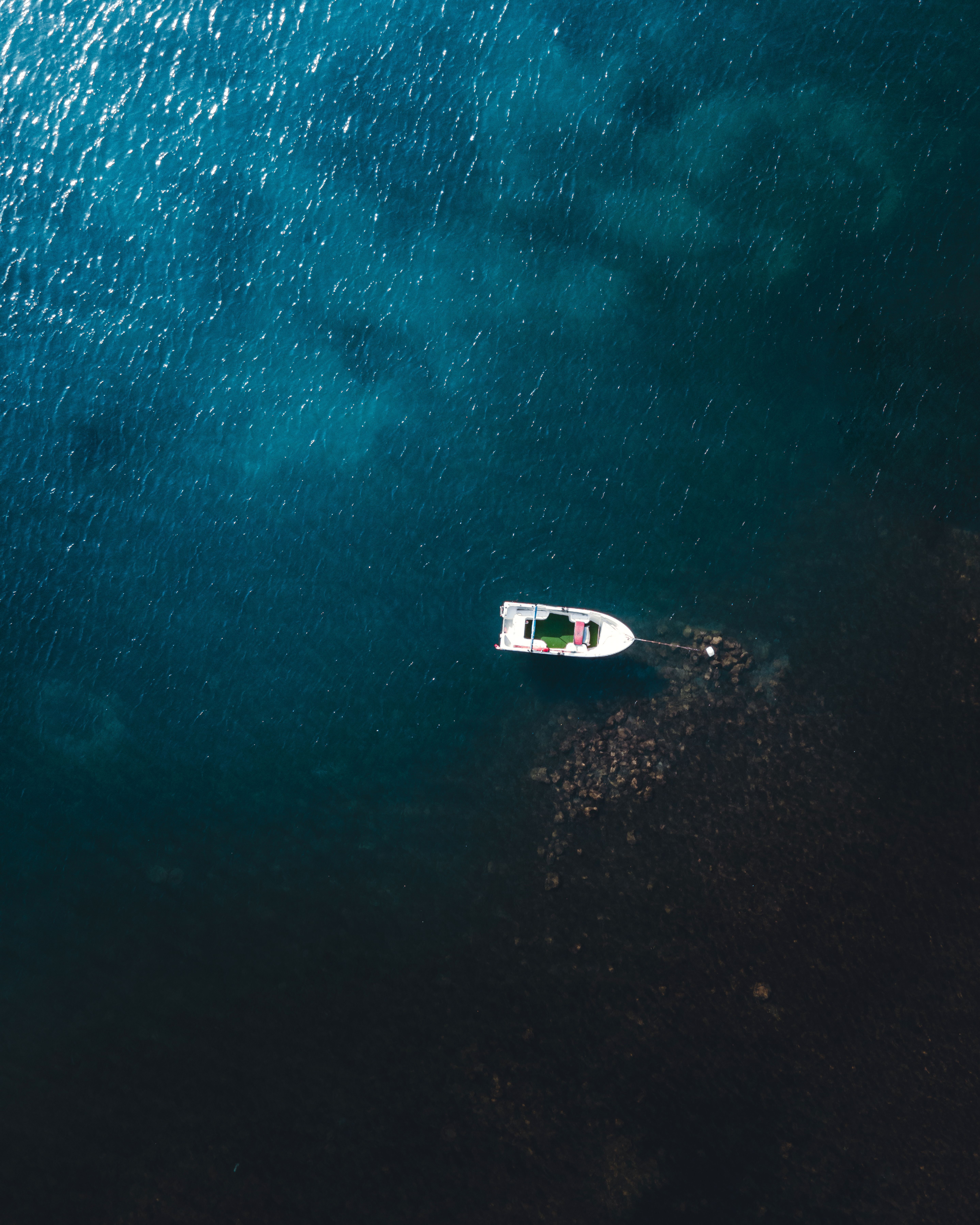 5753x7191 Aerial View of Boat on Deep Blue Ocean Water · Free