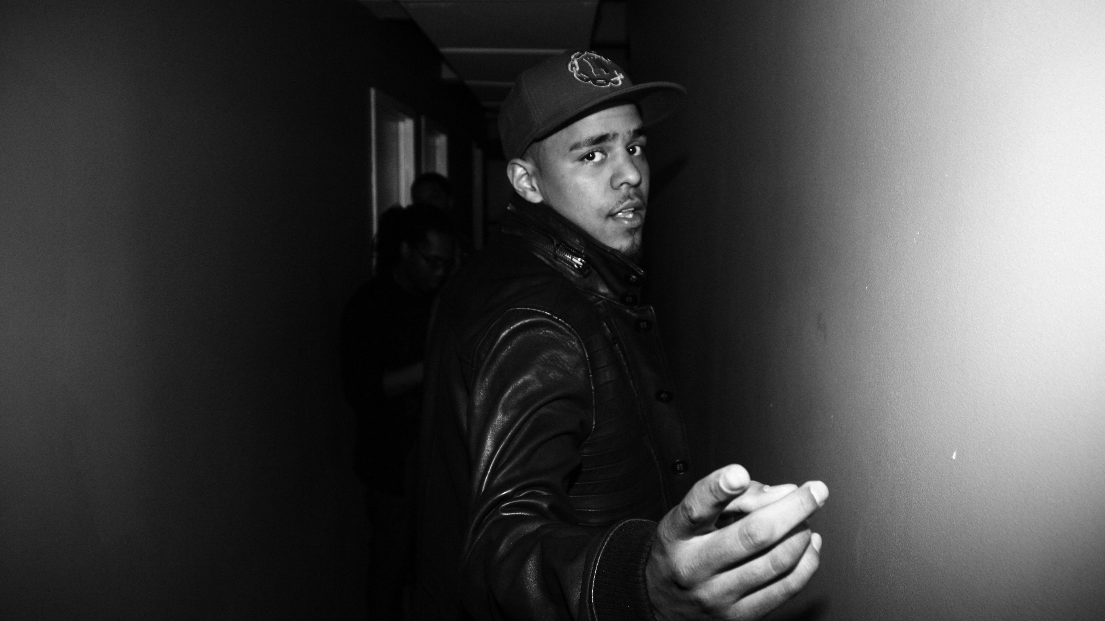 3840x2160 Black And White Photo Of J Cole Wearing Black Dress And Cap 4K HD Music Wallpaper