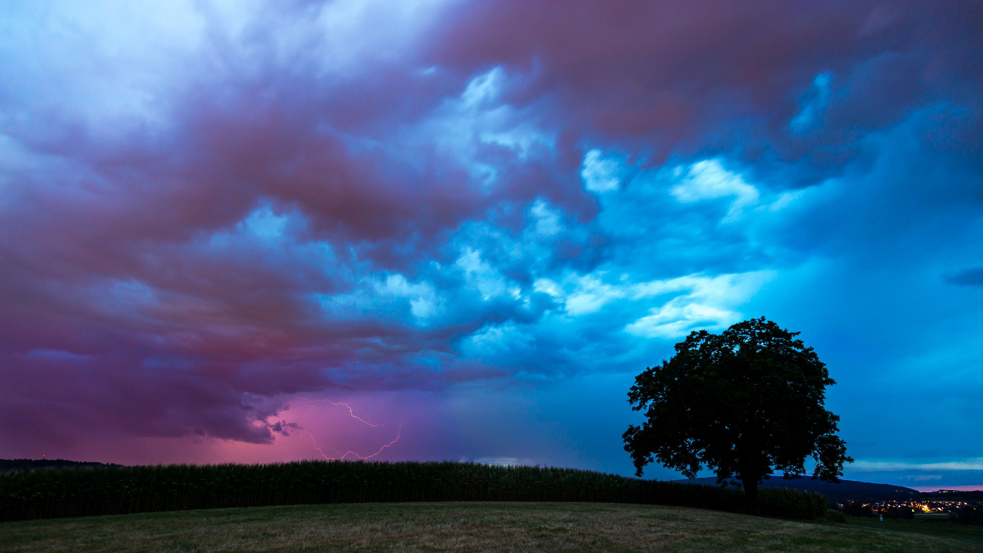 3840x2160 grass field clouds lightning storm tree wallpaper blue sky background 4K HD Nature Wallpaper