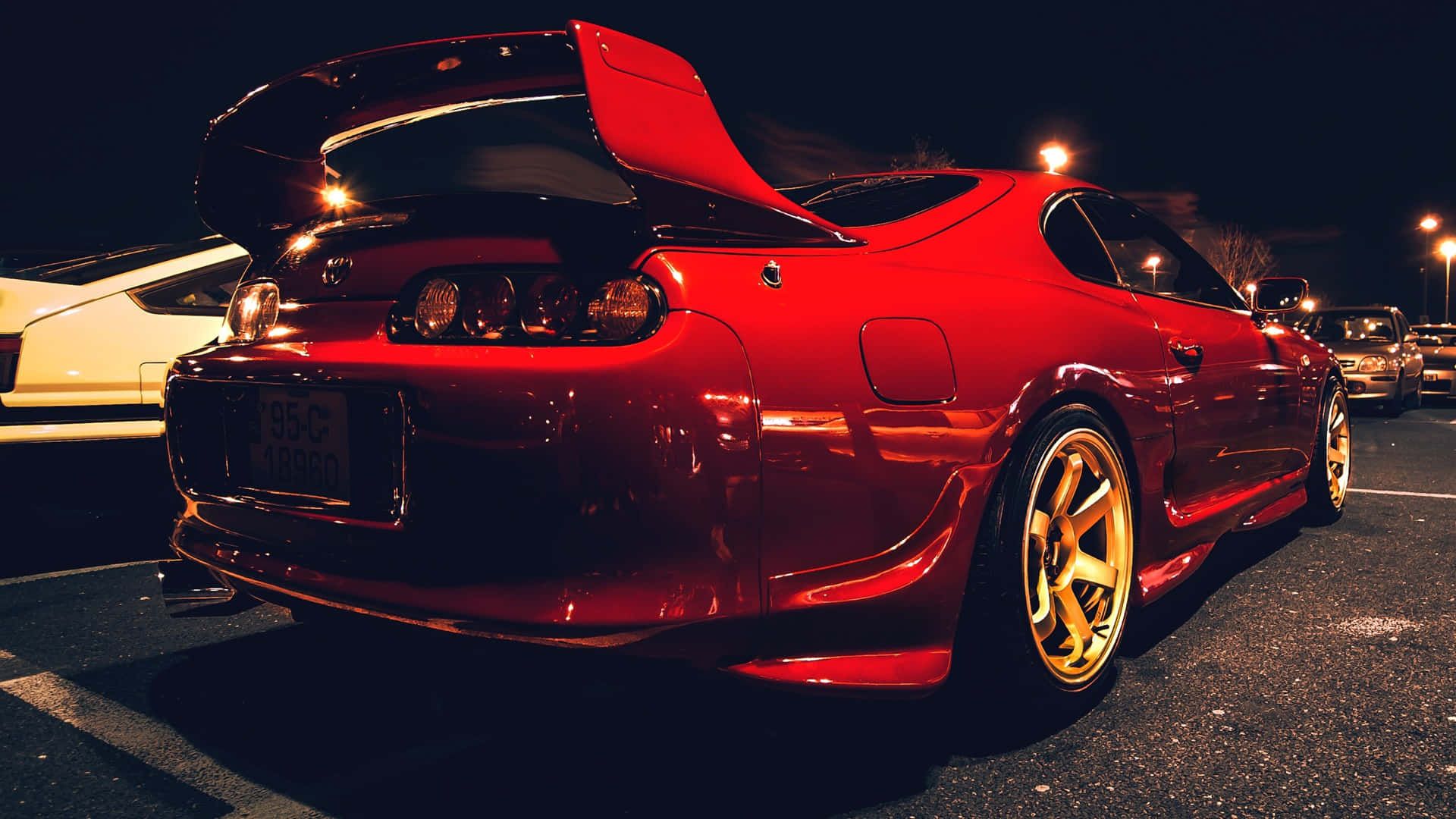 1920x1080 Download Sleek Red Toyota Supra on a Scenic Highway Background