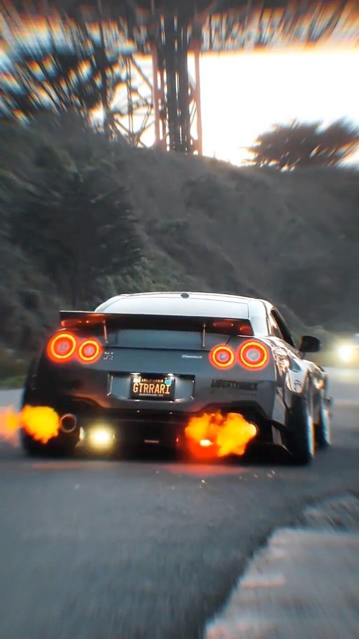 720x1280 Black Sports Car Speeding Through Scenic Road. Supra fire wallpaper, Supra mk4 car with flames, Supra drift wallpaper 1920x1080