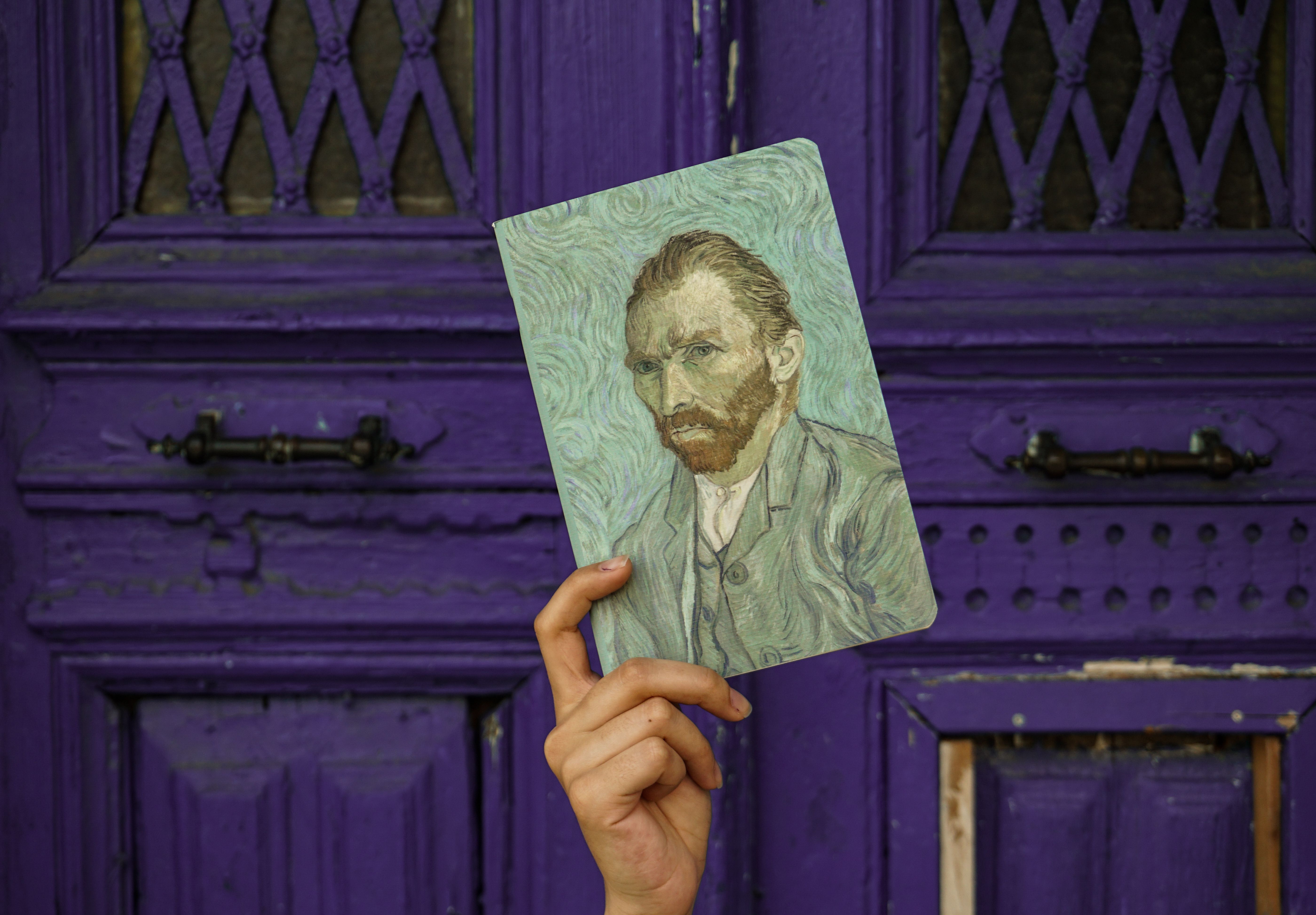 5598x3894 A Person Holding A Van Gogh Self Portrait · Free