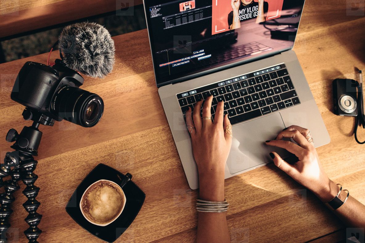 1184x789 Young Female Vlogger Editing Her Vlog On Computer Photo