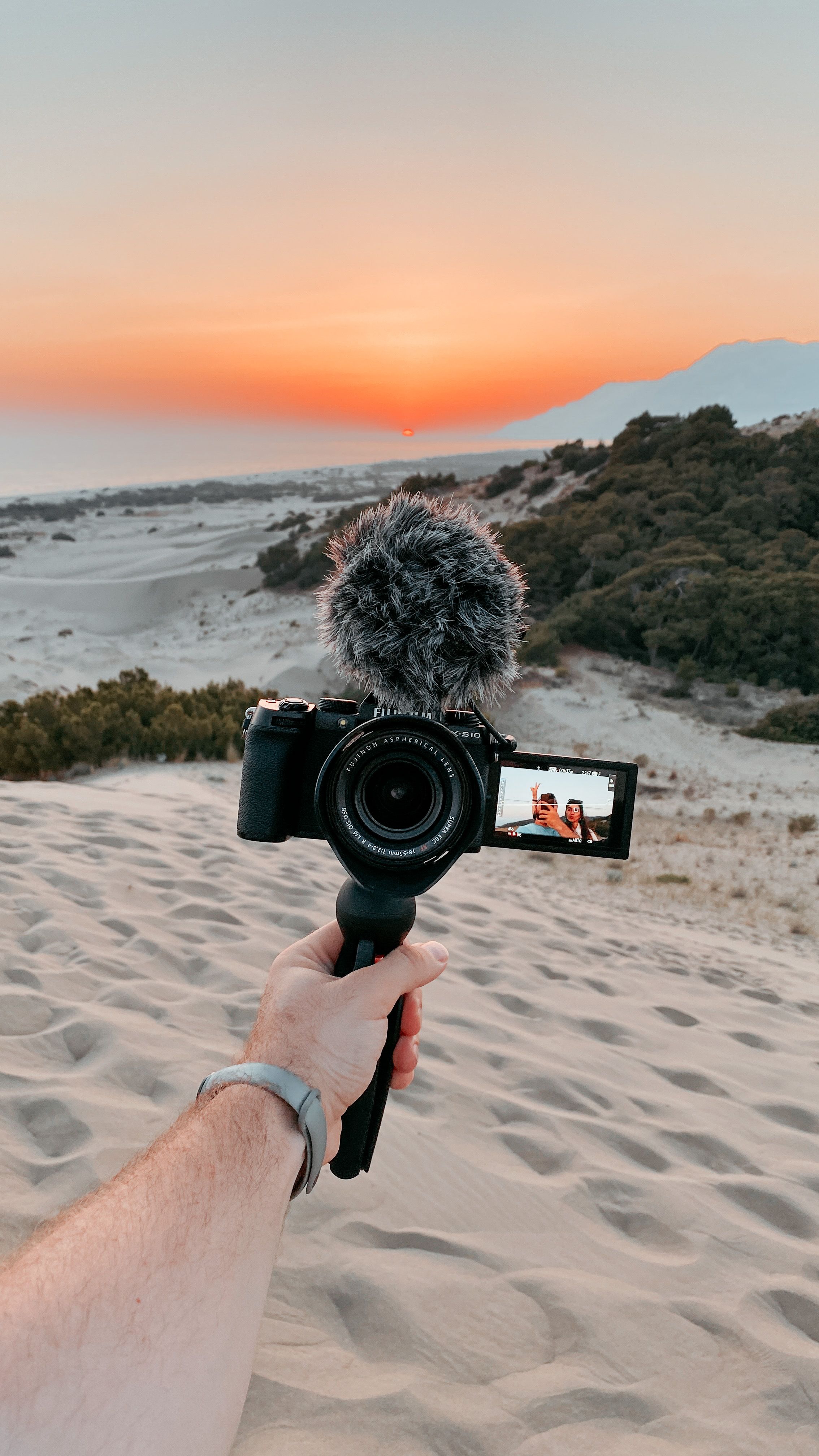 2268x4032 A Person Holding a Camera with Microphone · Free