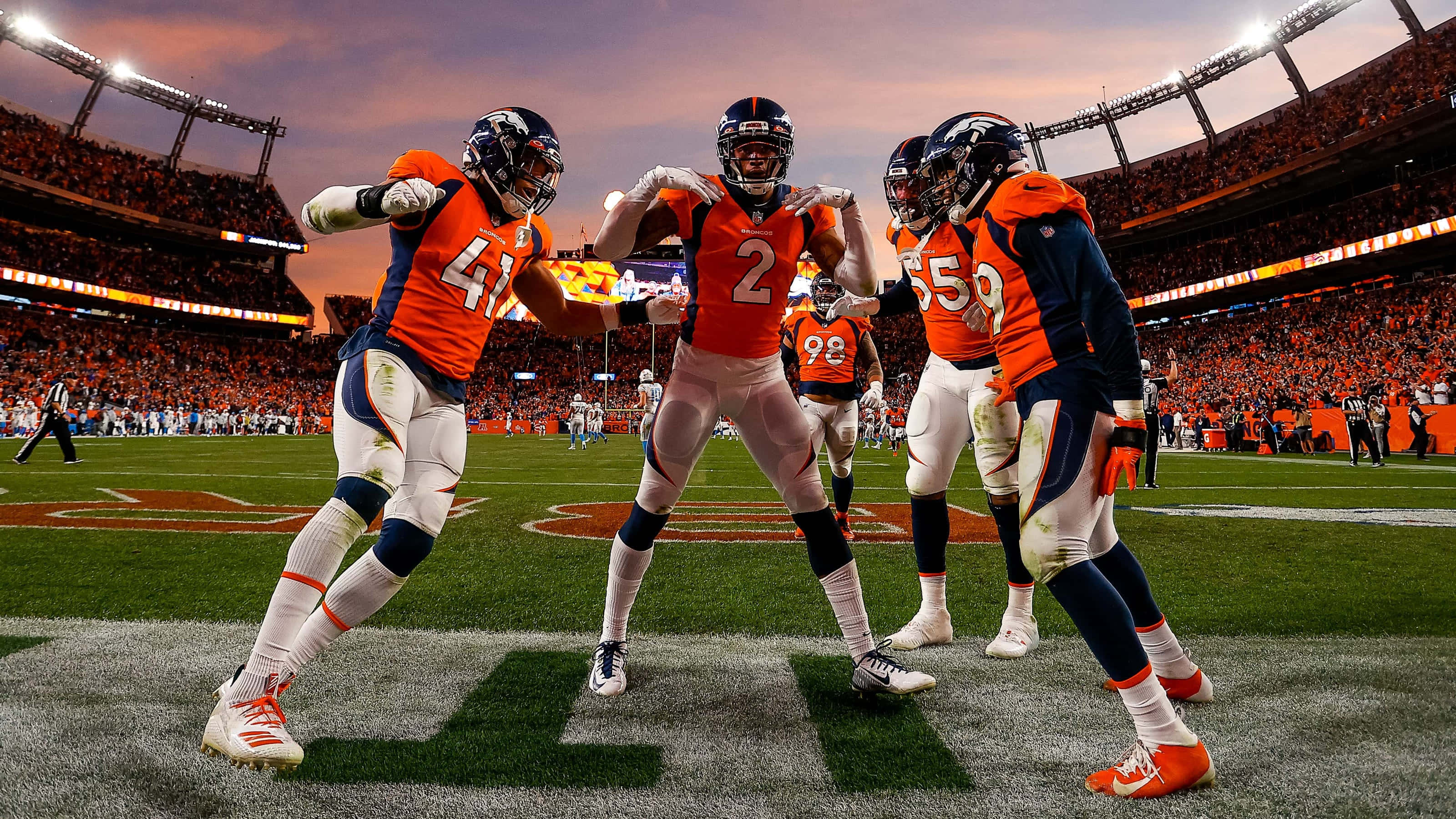 3200x1800 Download Broncos Players Celebratingon Field Wallpaper