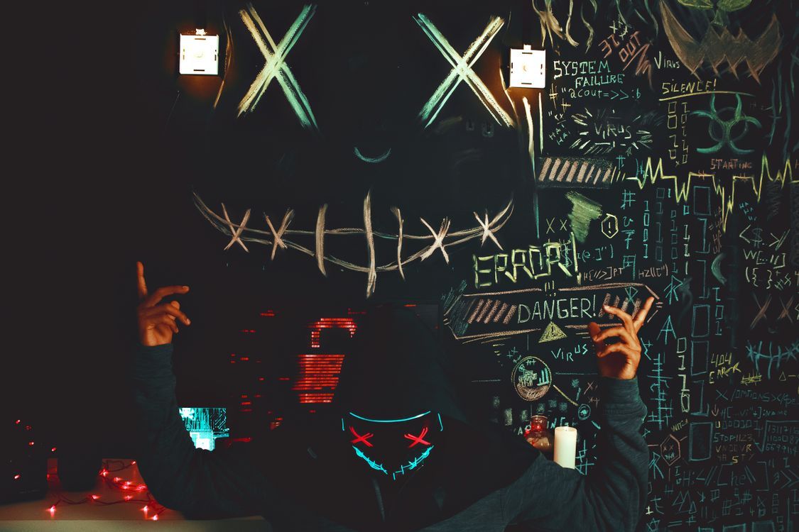 1125x750 An Anonymous Person Standing Near Black Board · Free