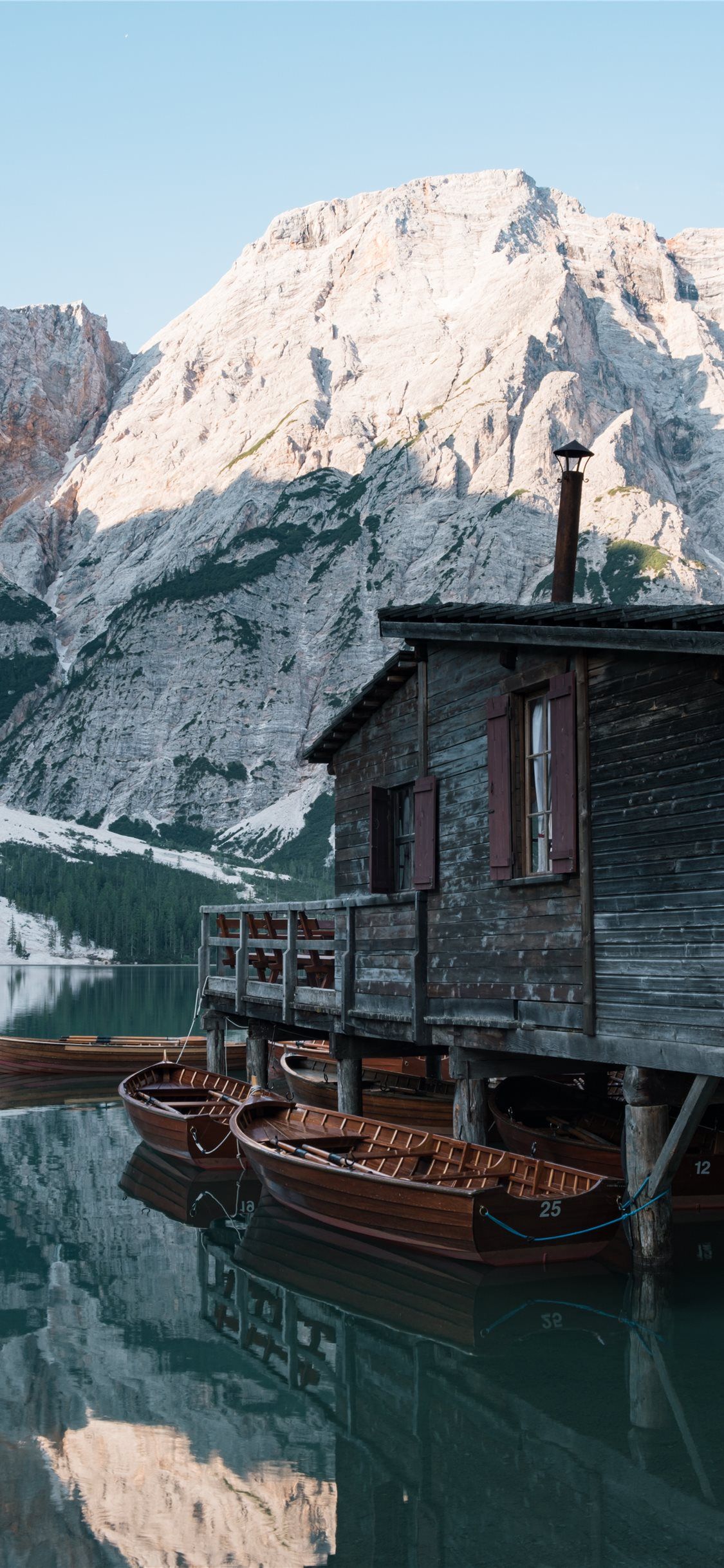 1125x2436 A house in the lake with a few boats iPhone X Wallpaper Free Download