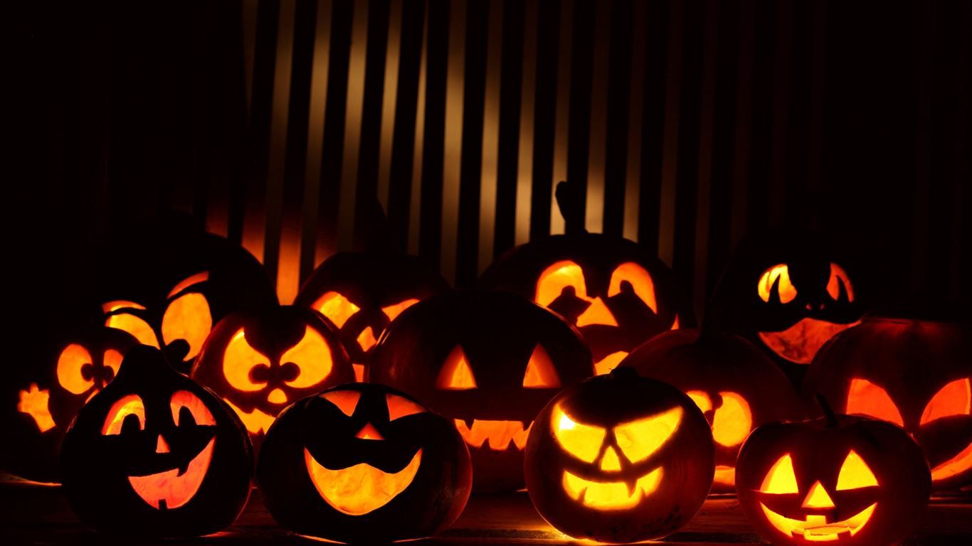 1366x768 Halloween Pumpkins In The Dark MacBook Air Wallpaper Download