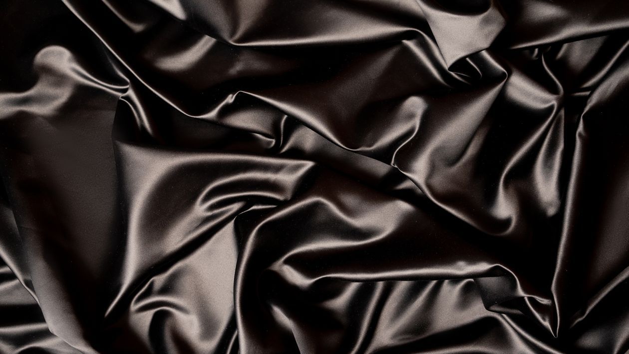 1260x709 Wrinkled Black Textile In Close Up Shot · Free