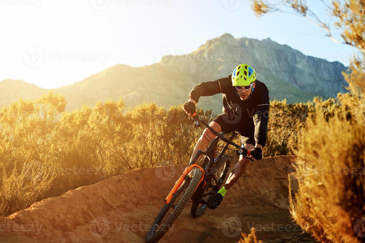 1469x980 Man, cyclist and mountain with sunset or bicycle on dirt track for adrenaline rush, fitness or