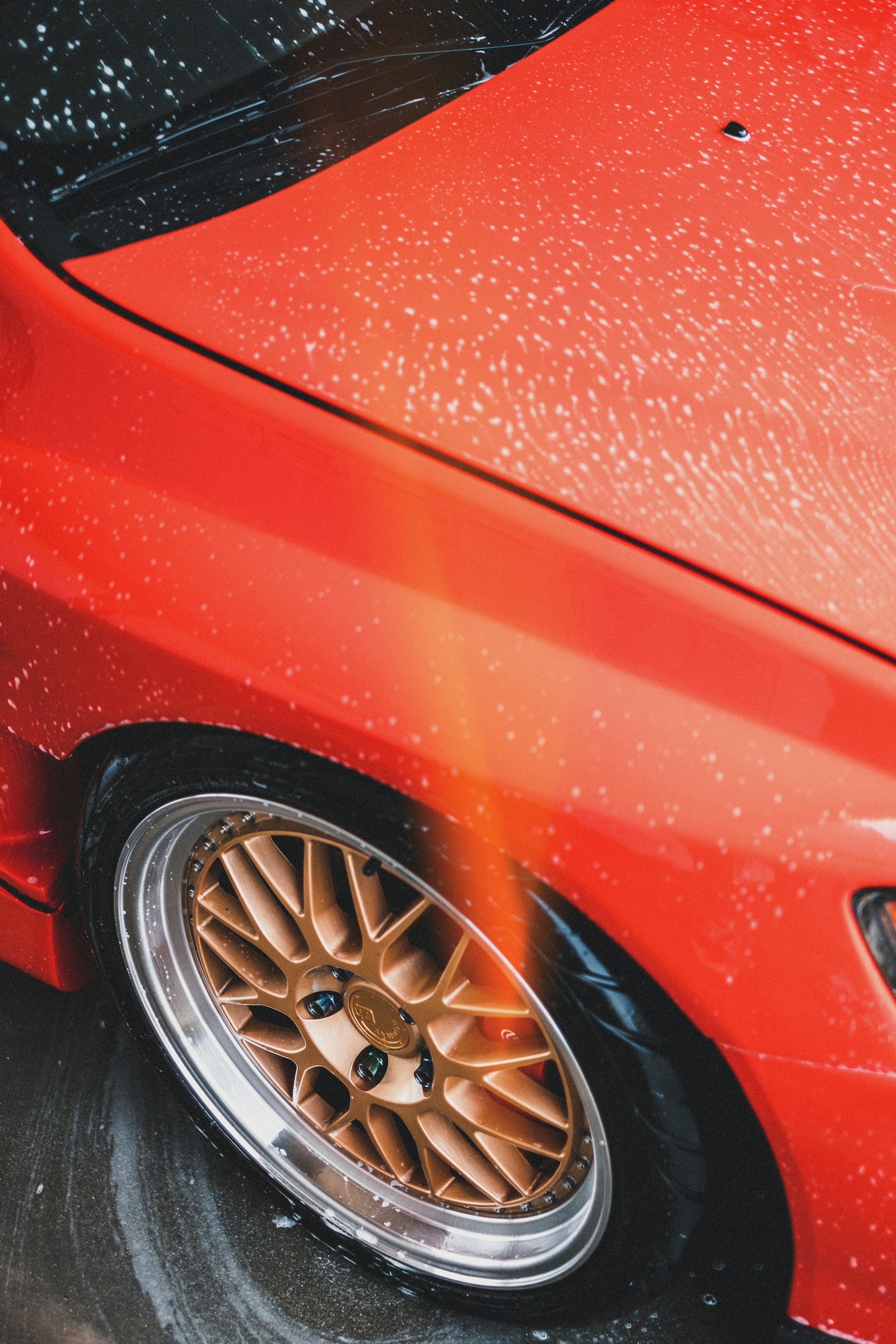 3000x4500 Red Vehicle Showing Brass Multi Spoke Wheel And Tire Set