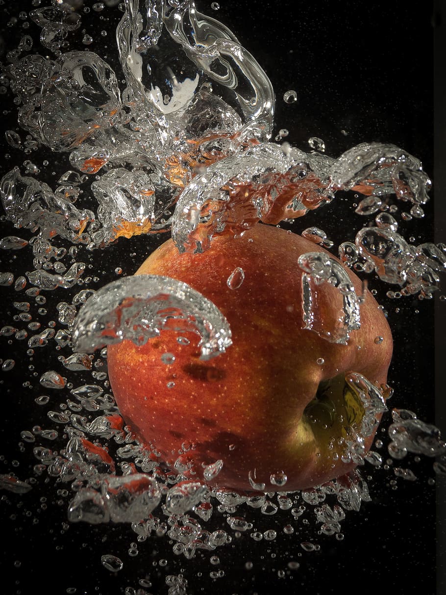 910x1213 HD wallpaper: Apple, Water, Splash, Inject, underwater, no people, black background