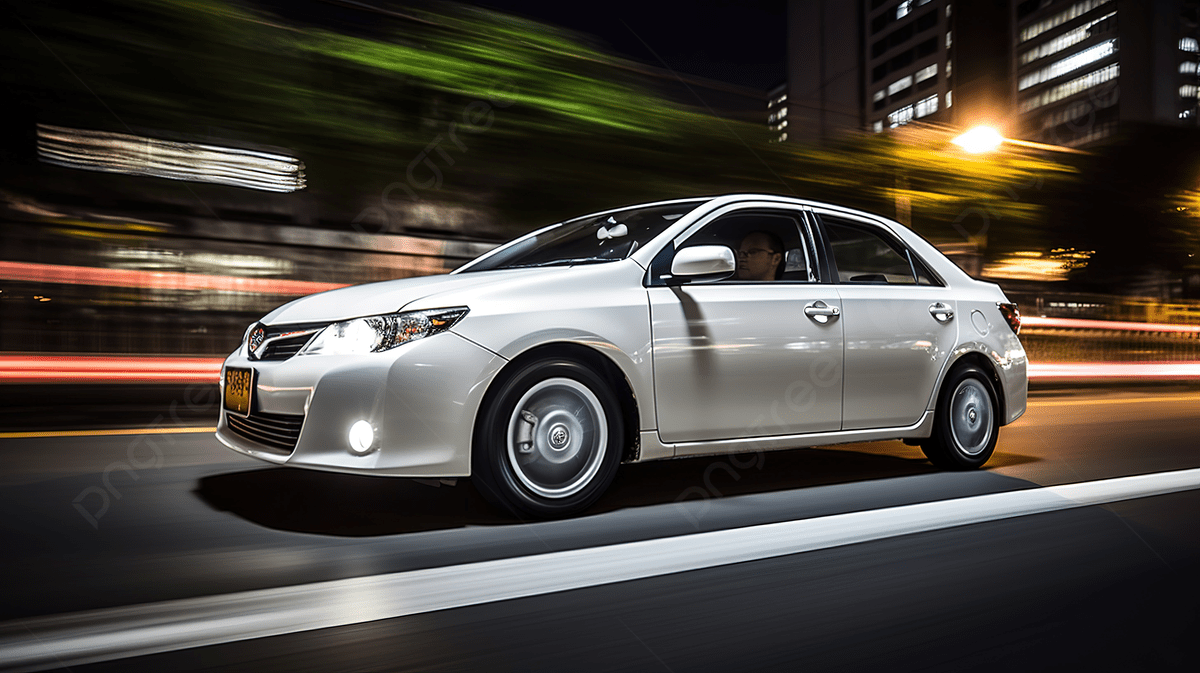 1200x673 The White Toyota Corolla Is On The Road At Night Photo And Picture For Free Download