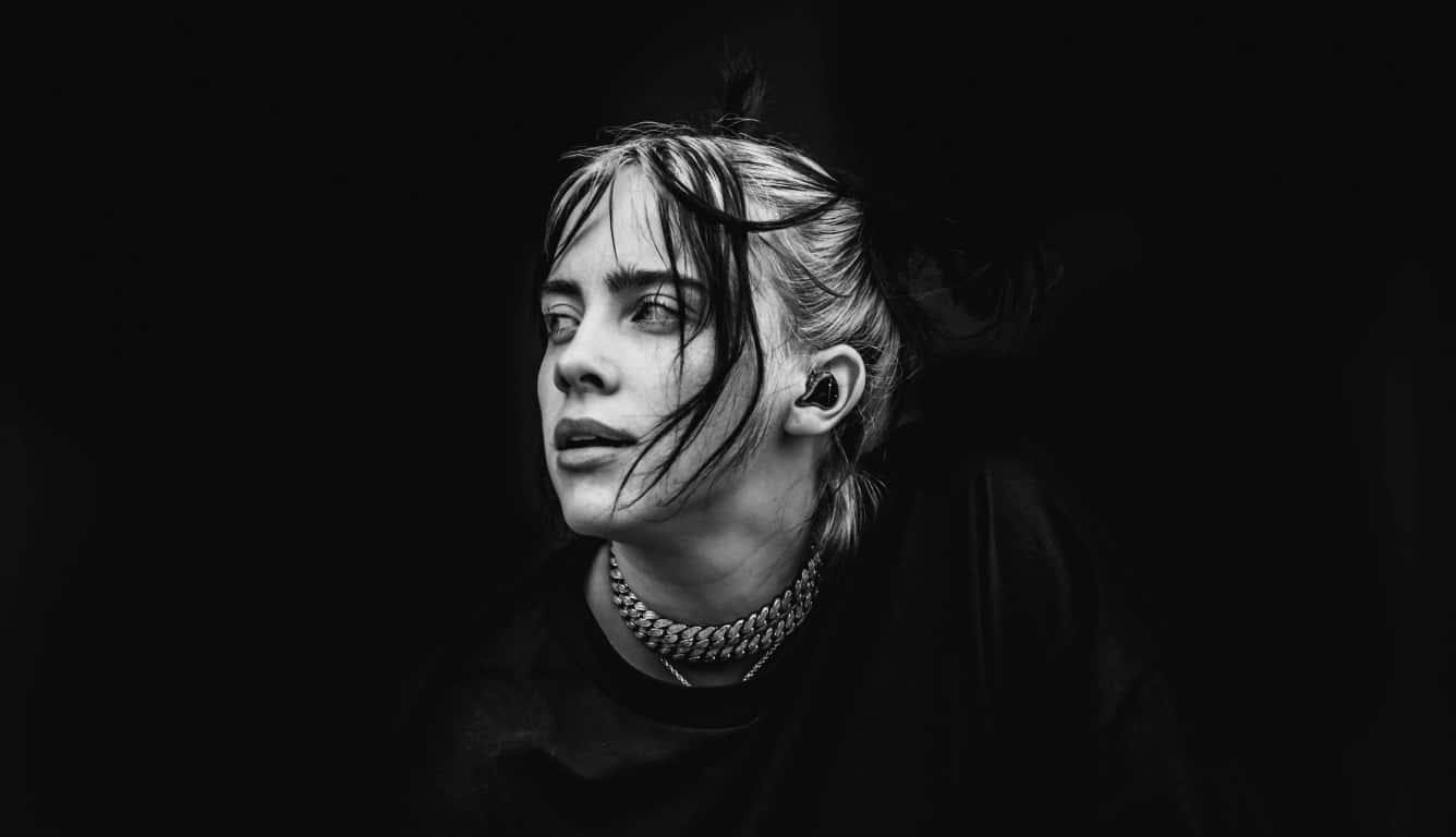 1336x768 Download Billie Eilish Surfing on Her Laptop Wallpaper