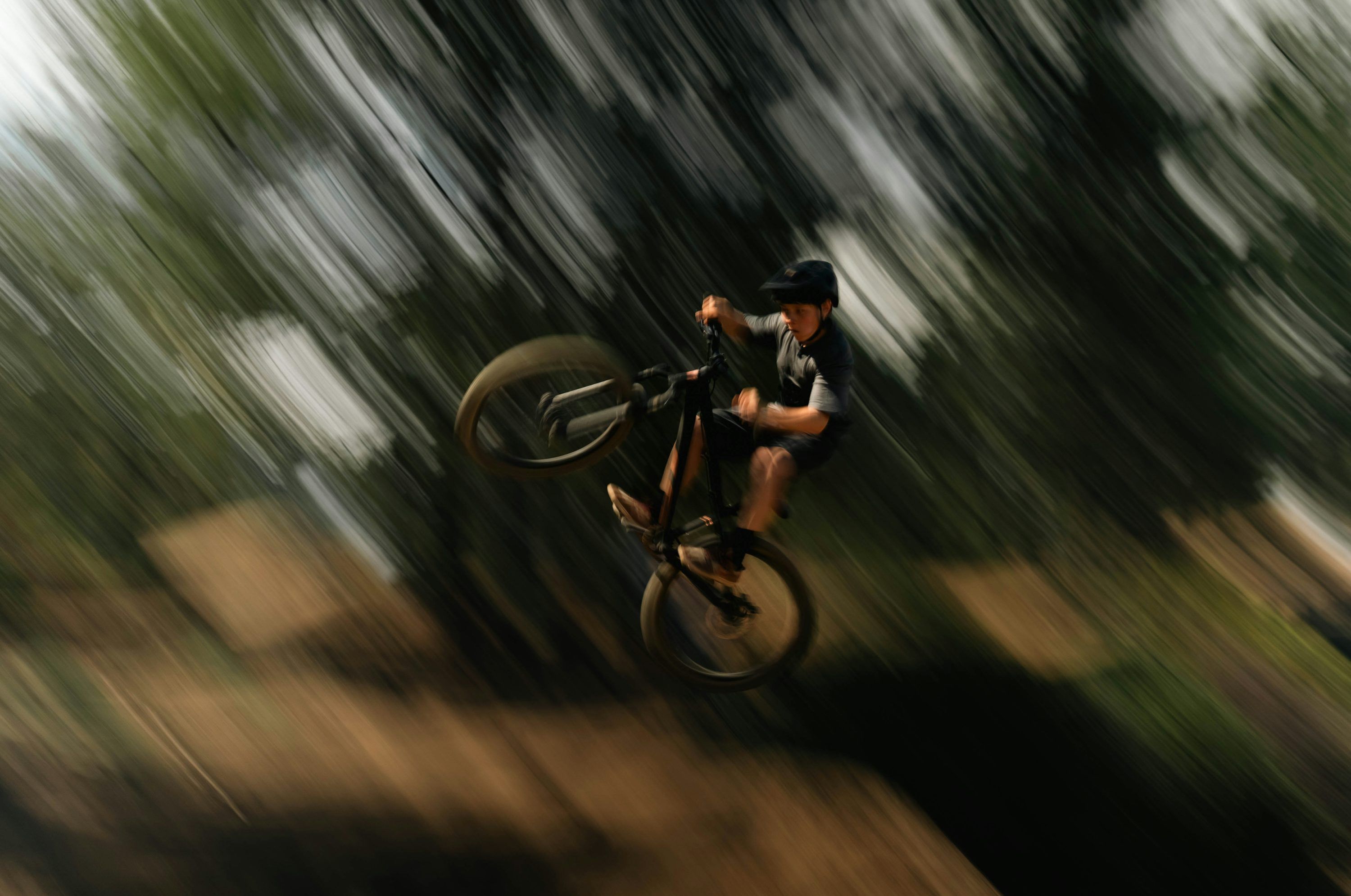 3000x1991 Mountain Biker Does A Wheelie In Mid Air