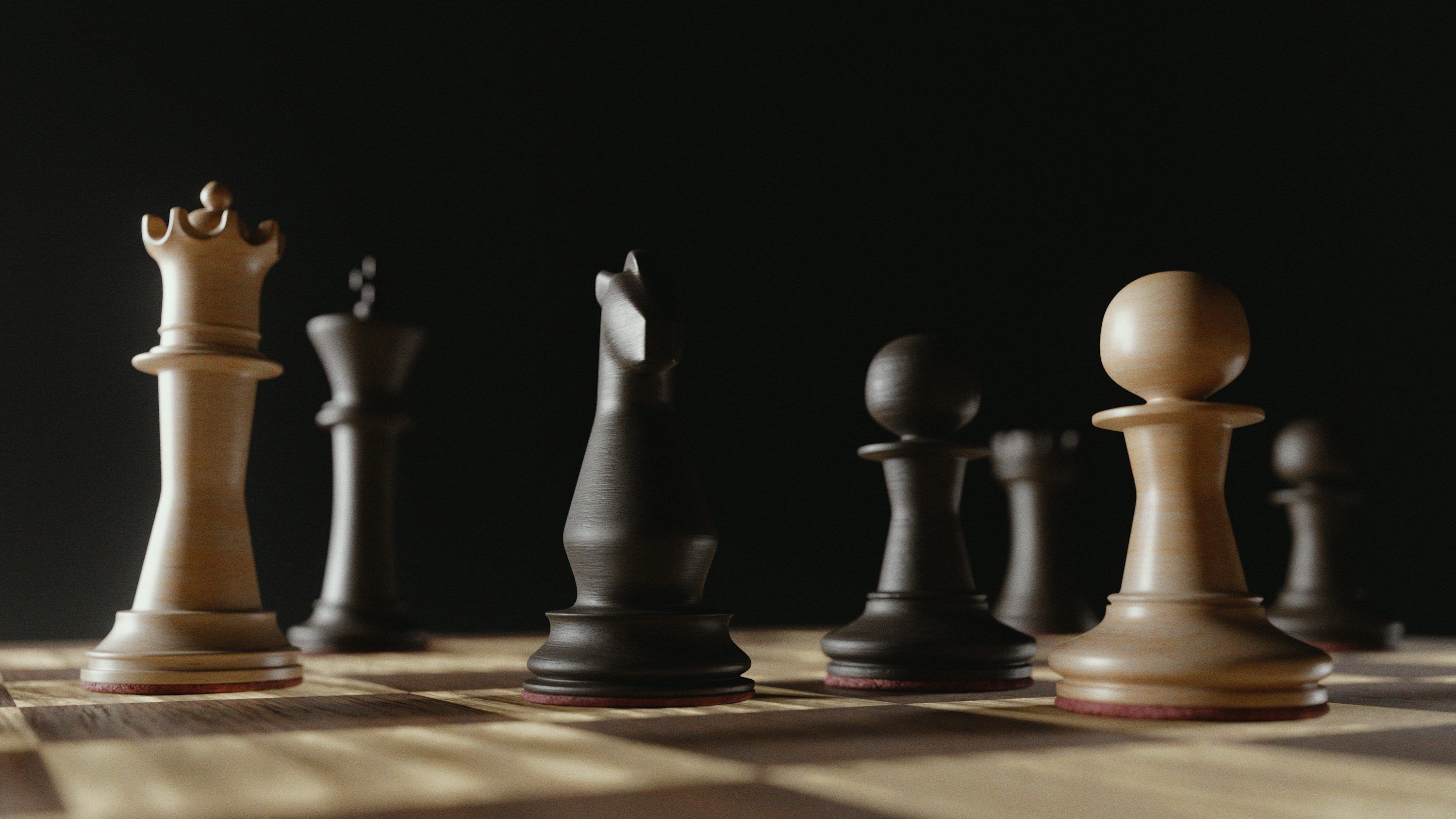 3000x1688 Chess pieces on a wooden board with dark background