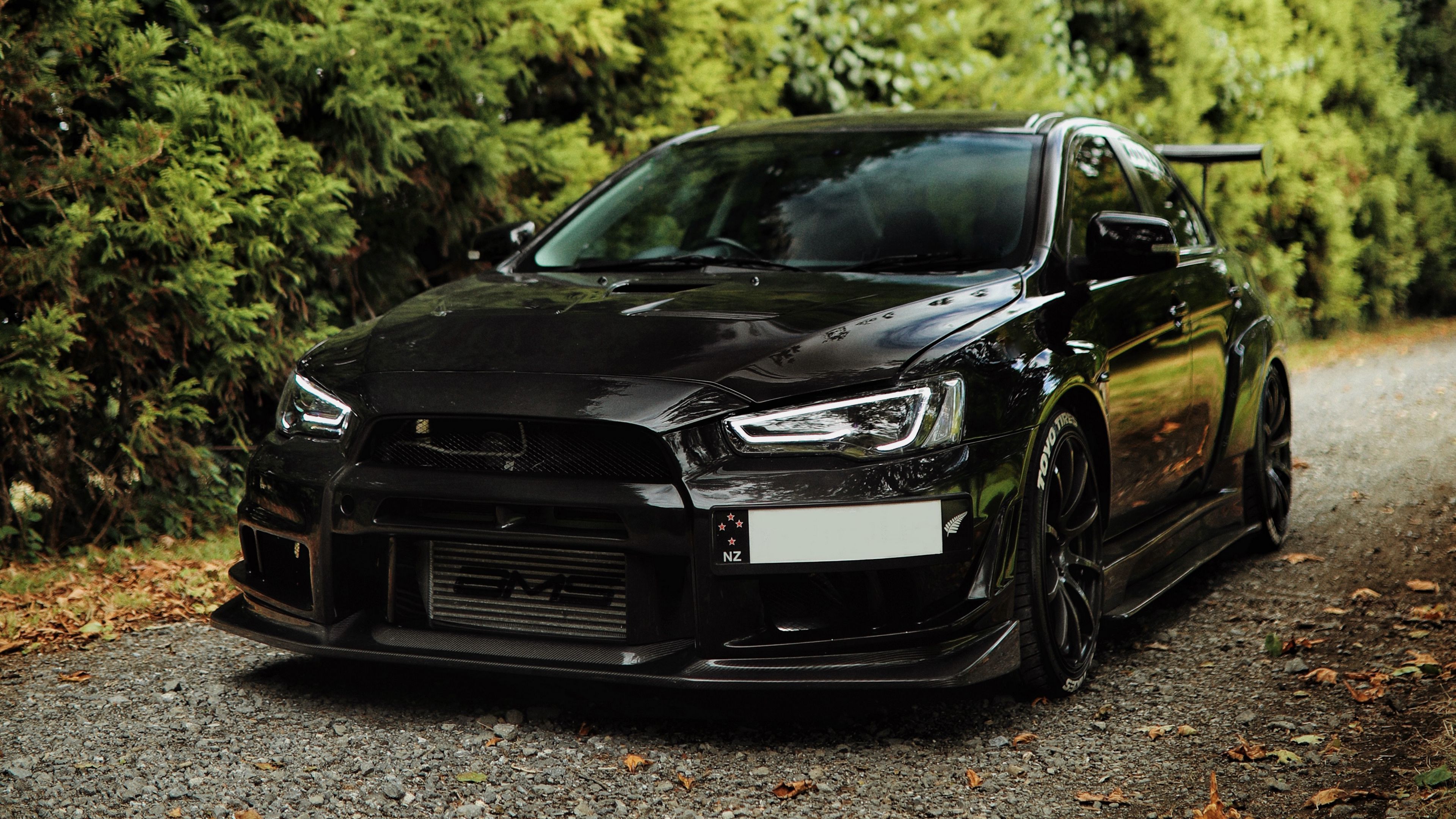 3840x2160 Download wallpaper 3840x2160 mitsubishi lancer evolution, mitsubishi, black, front view 4k uhd 16:9 HD background