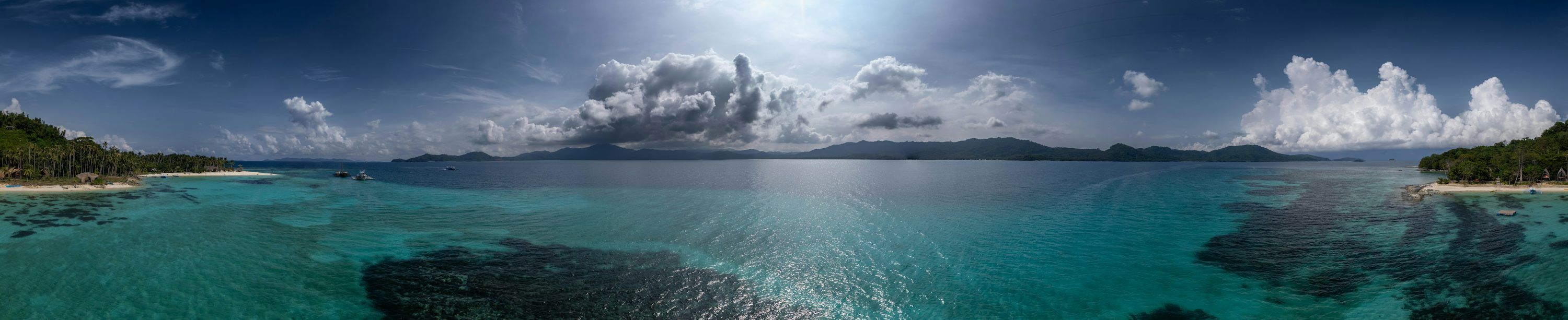 3000x613 Tropical island coastline with clear turquoise water