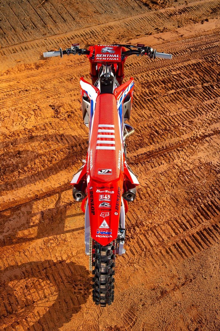 736x1105 Red Dirt Bike on a Field. Honda dirt bike wallpaper, Honda crf250r wallpaper, Red dirt