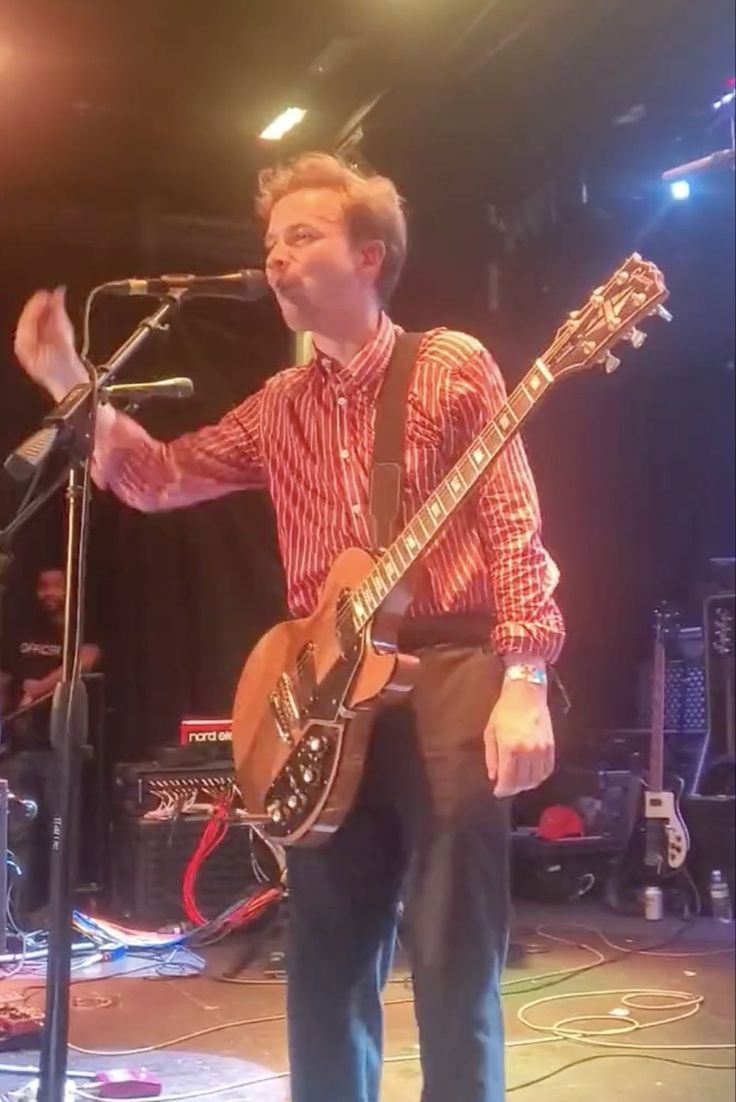 736x1102 Geordie Greep from black midi eating the setlist at their show in Tampa