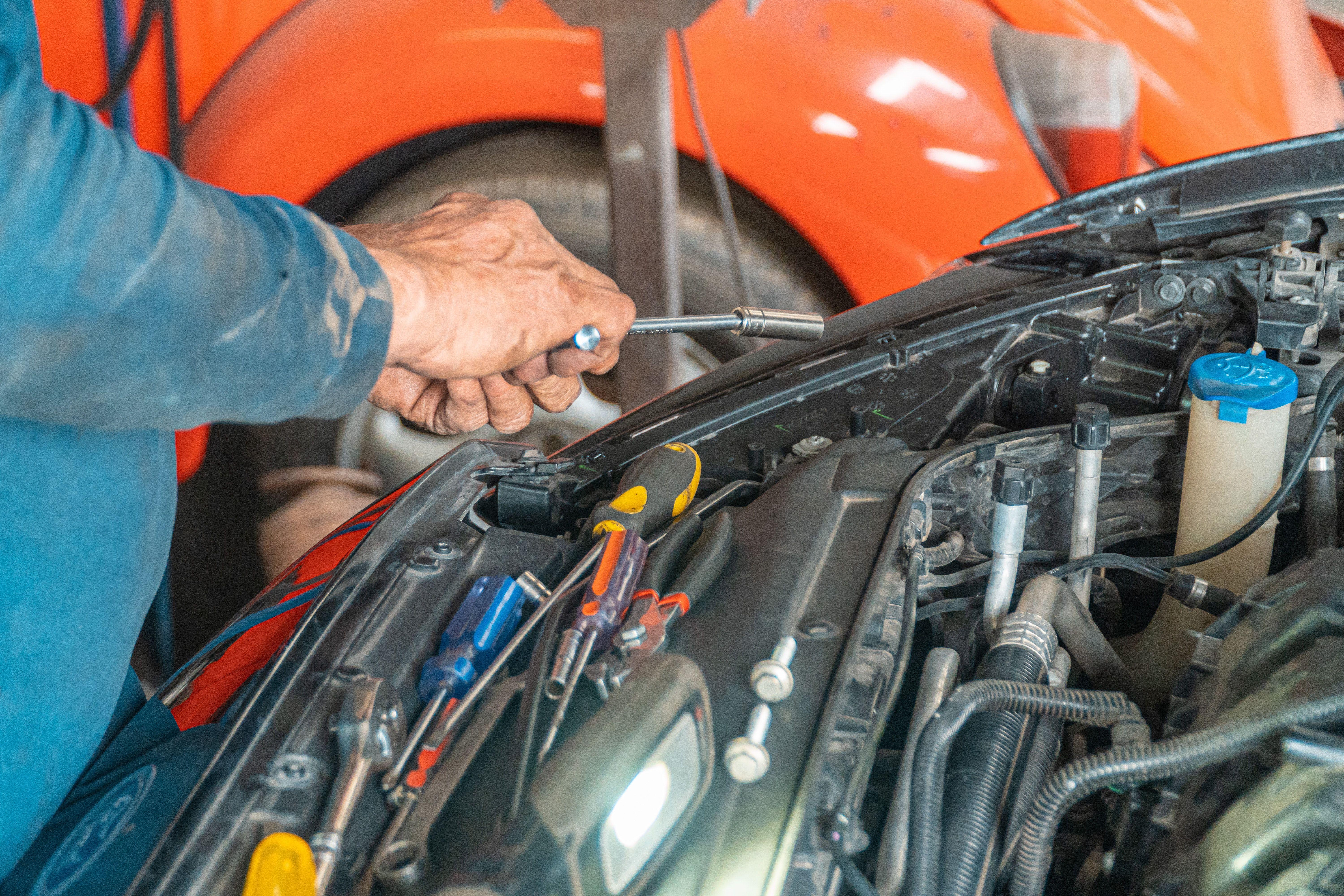 6000x4000 Car Mechanic Holding A Tool For Repair · Free