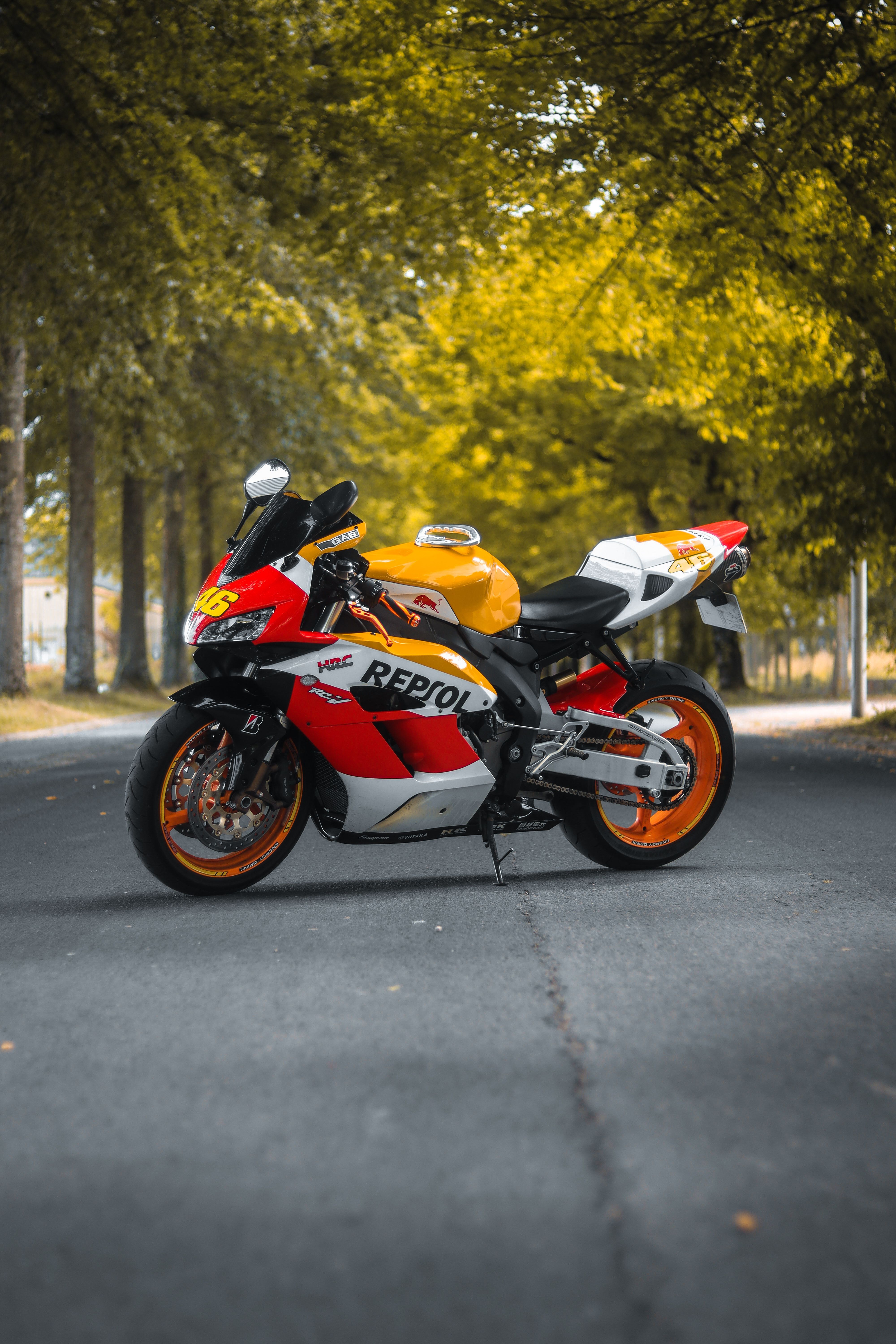 4000x6000 Honda CBR 1000RR Fireblade Motorcycle Parked on Street under Trees · Free