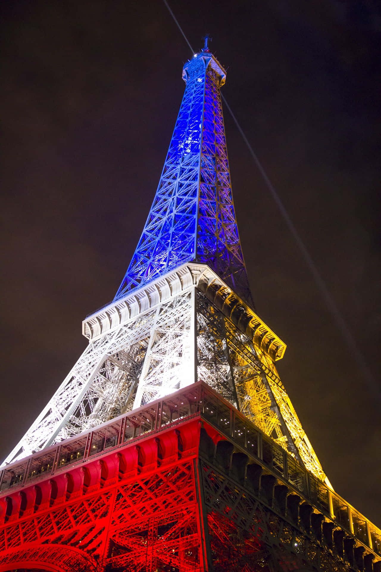 1280x1920 Download Bastille Day Celebrations Lighting Up the Eiffel Tower Wallpaper