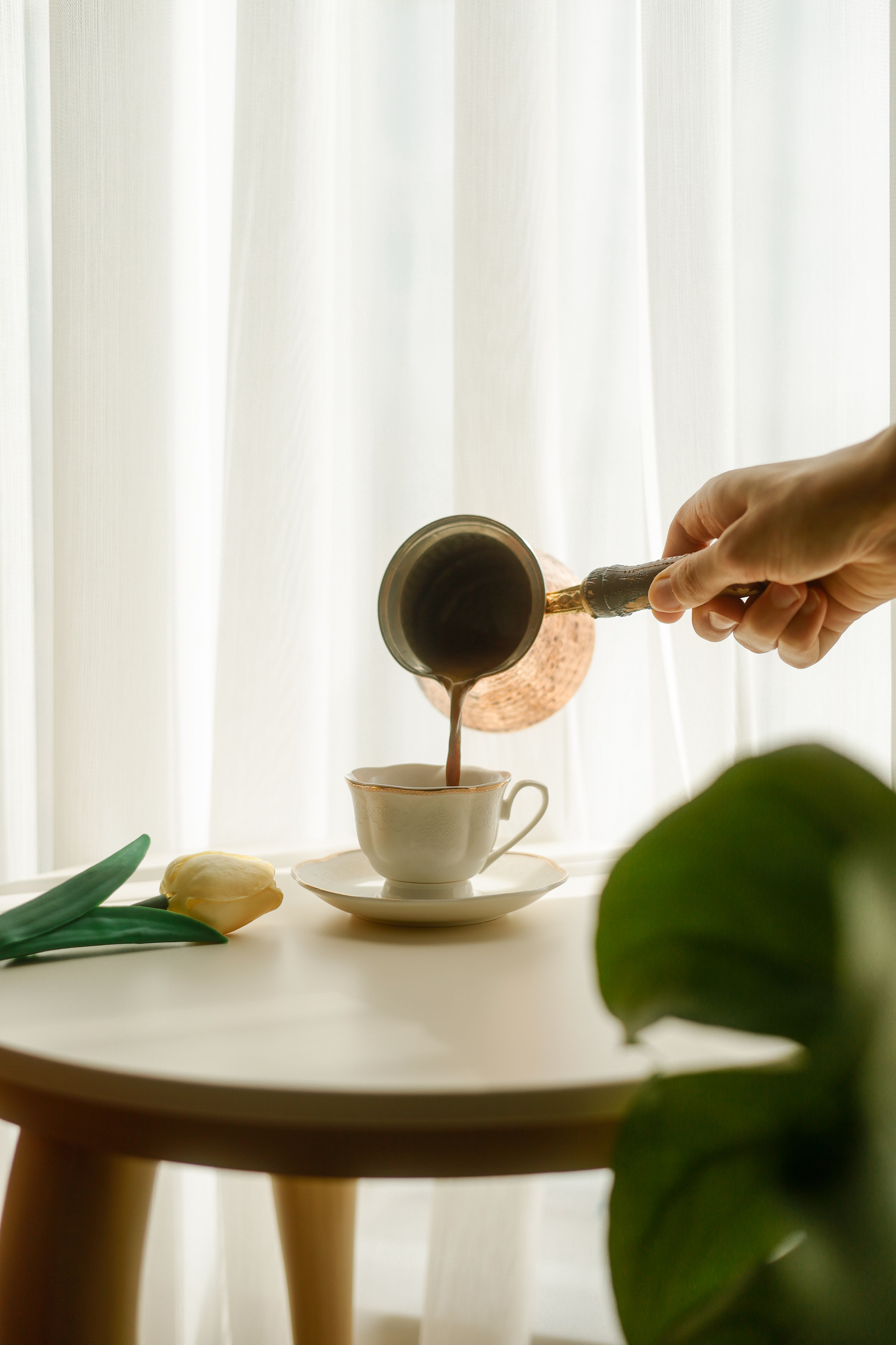 4160x6240 Pouring Coffee Into Cup with Sunlit Background · Free