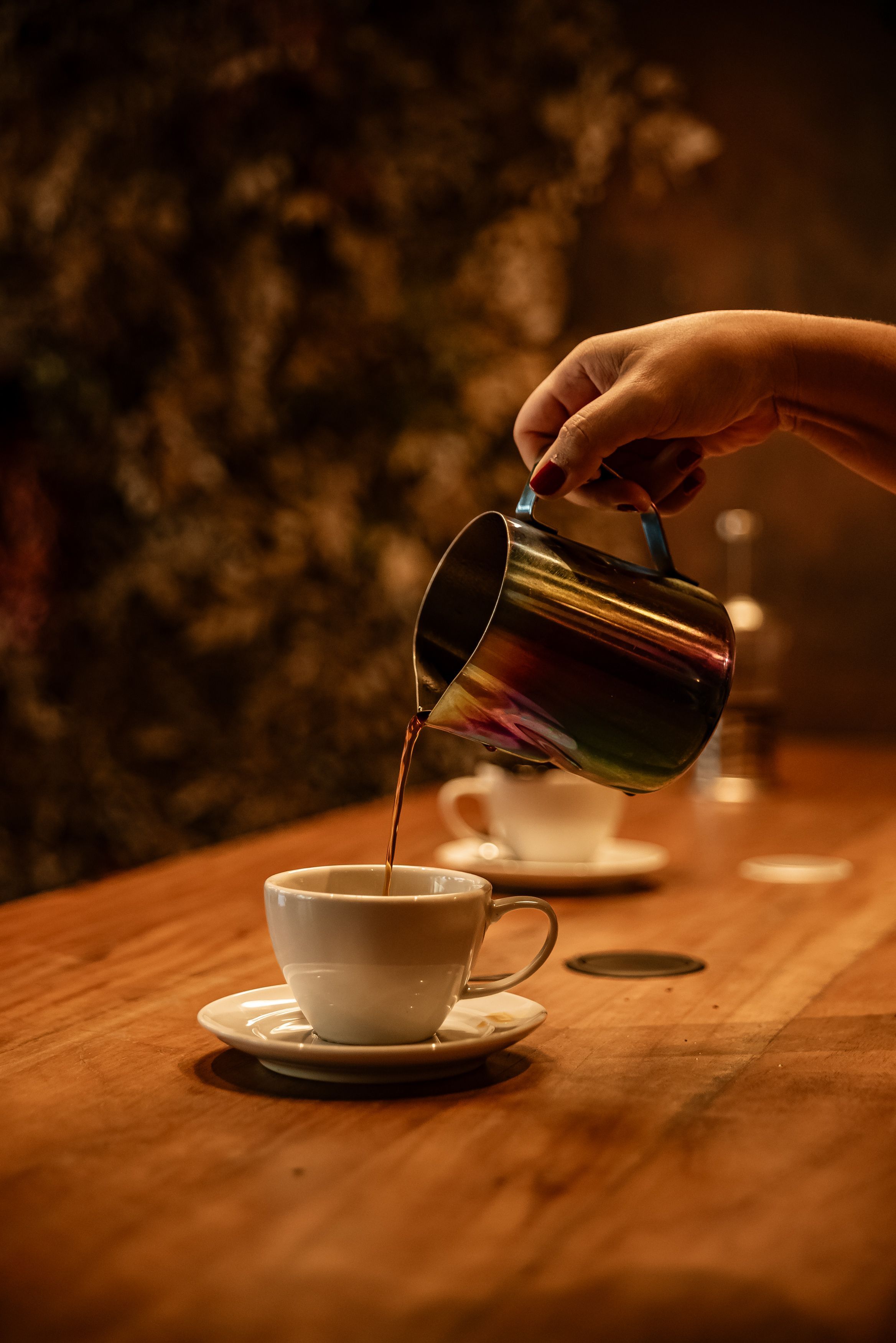 2336x3500 Hand of a Woman Pouring a Cup of Coffee · Free