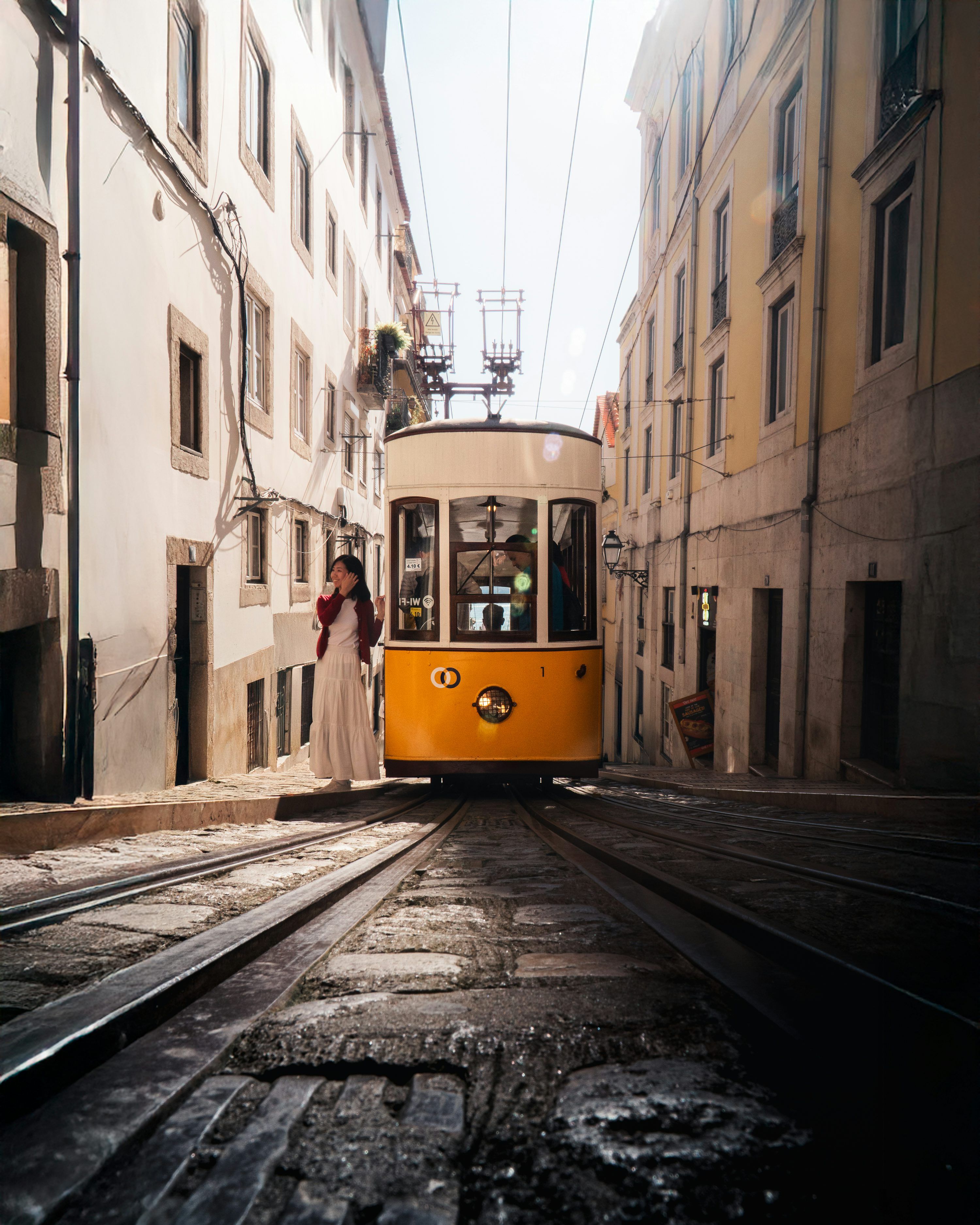 3000x3750 A yellow tram on a stone street. photo