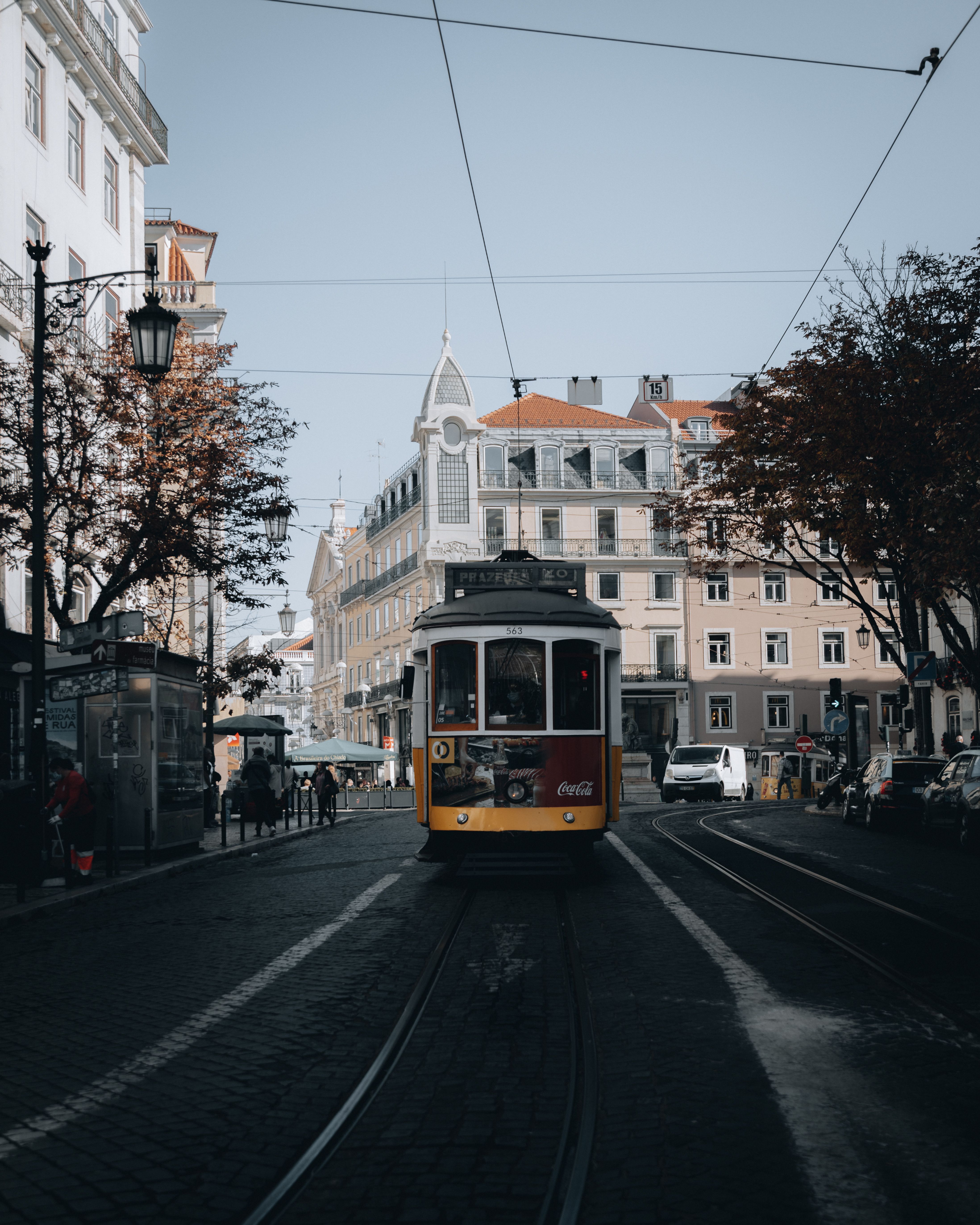 4391x5489 Lisbon Iconic Yellow Tram in Cityscape · Free